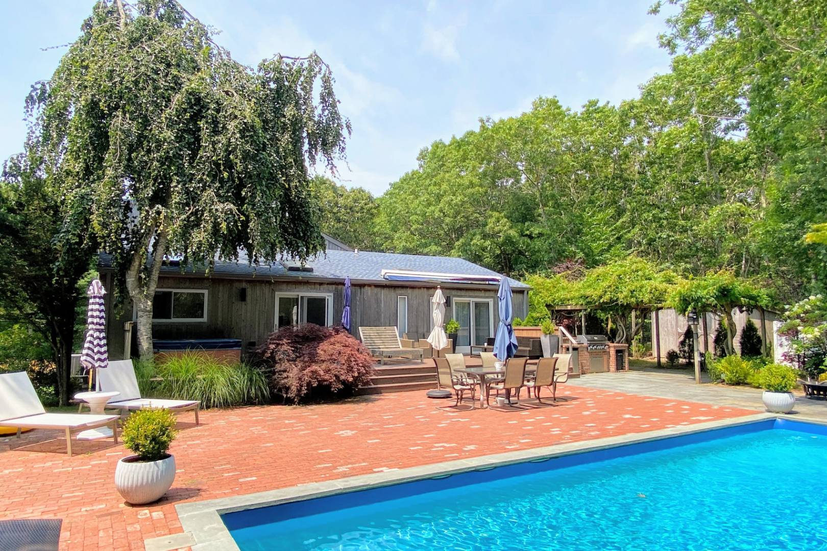 30 Wheelock Walk East Hampton, NY 11937 - Photo 10 of 15 a view of a house with swimming pool and sitting area