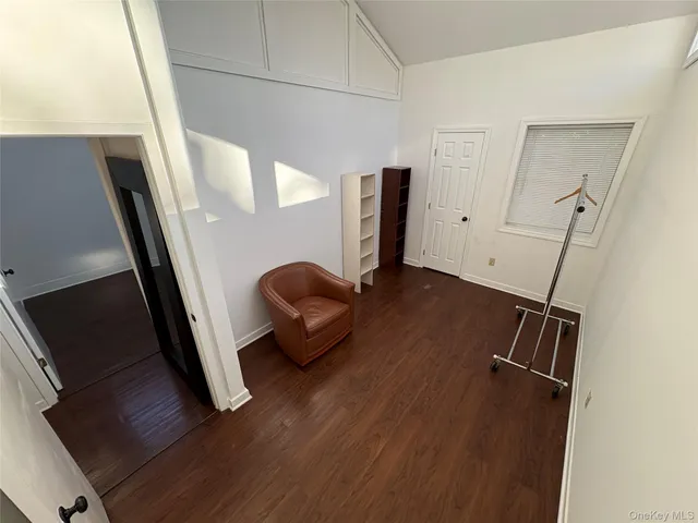 a view of an entryway with wooden floor