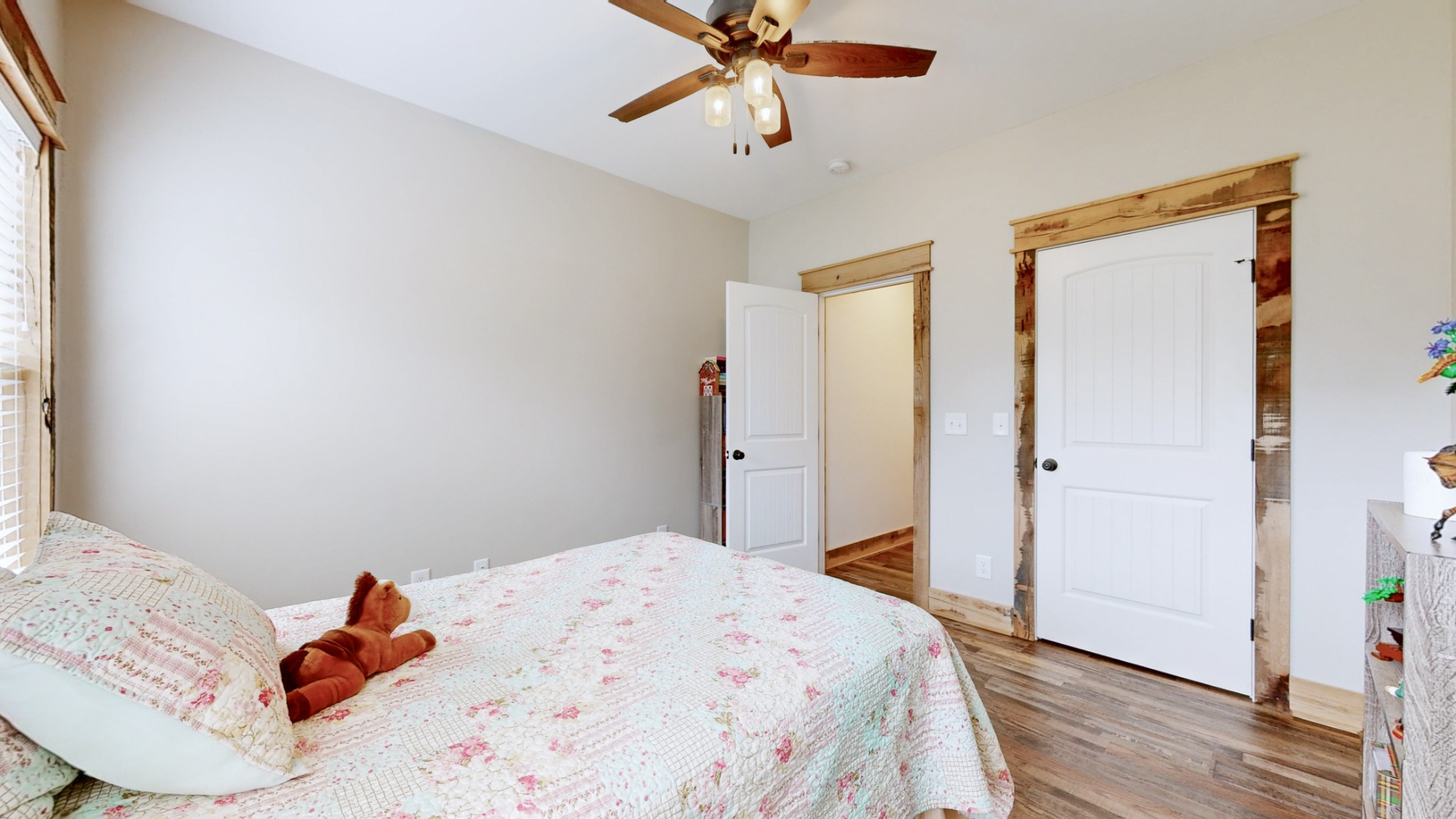 601 King Ridge Road Dowelltown, TN 37059 - Photo 33 of 49 a bedroom with a bed and a chandelier