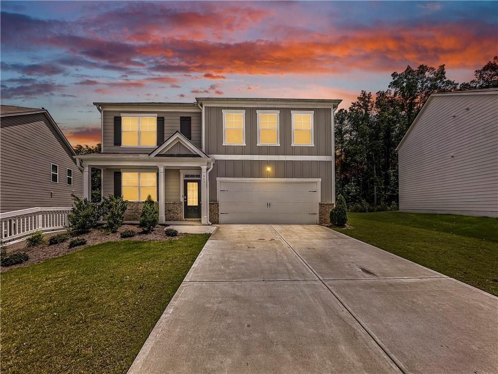 965 Athena Bend Fairburn, GA 30213 - Photo 2 of 37 a front view of a house with garden