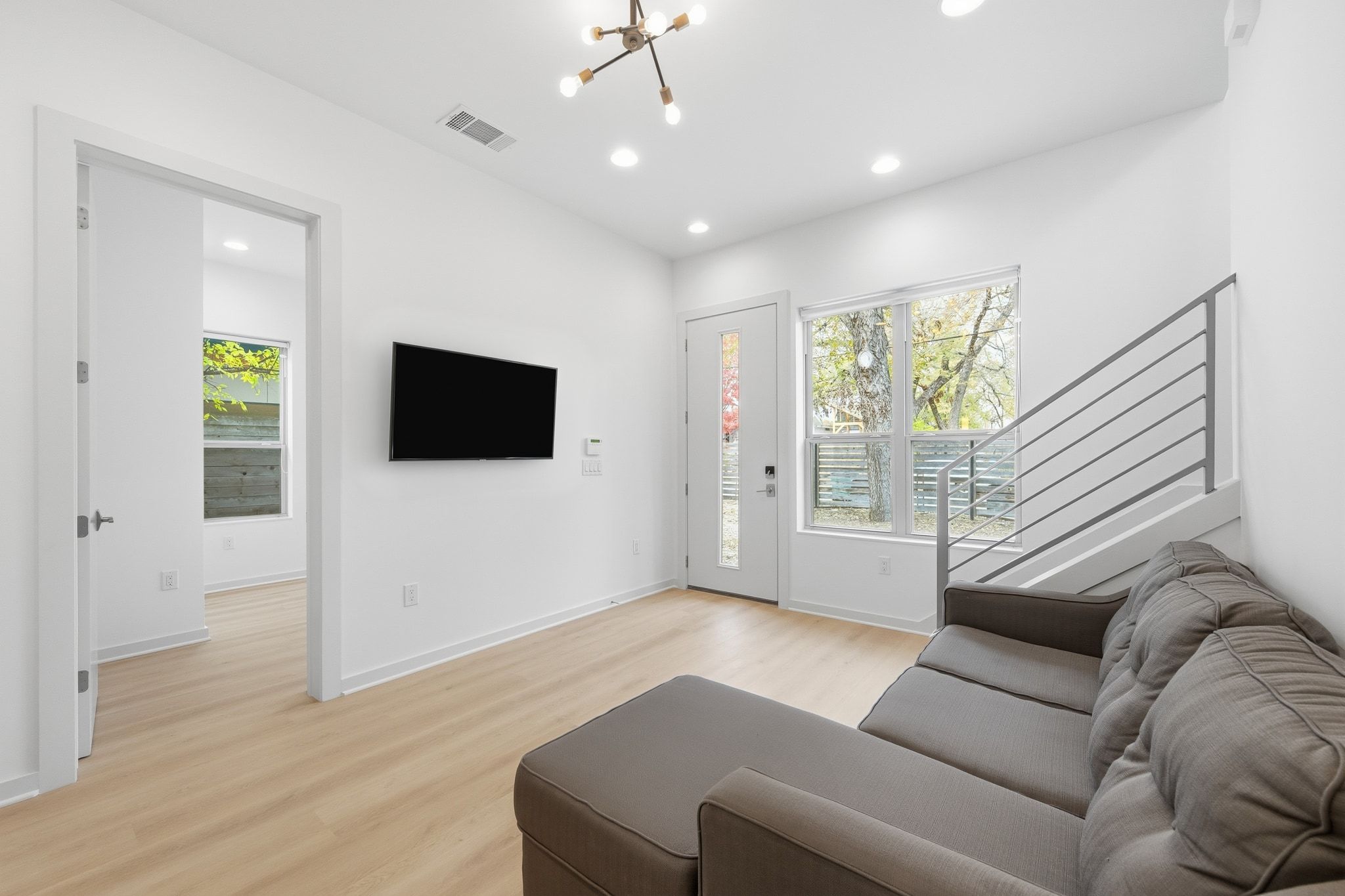 2811 Garwood Street, Unit A Austin, TX 78702 - Photo 12 of 27 a living room with furniture and a flat screen tv