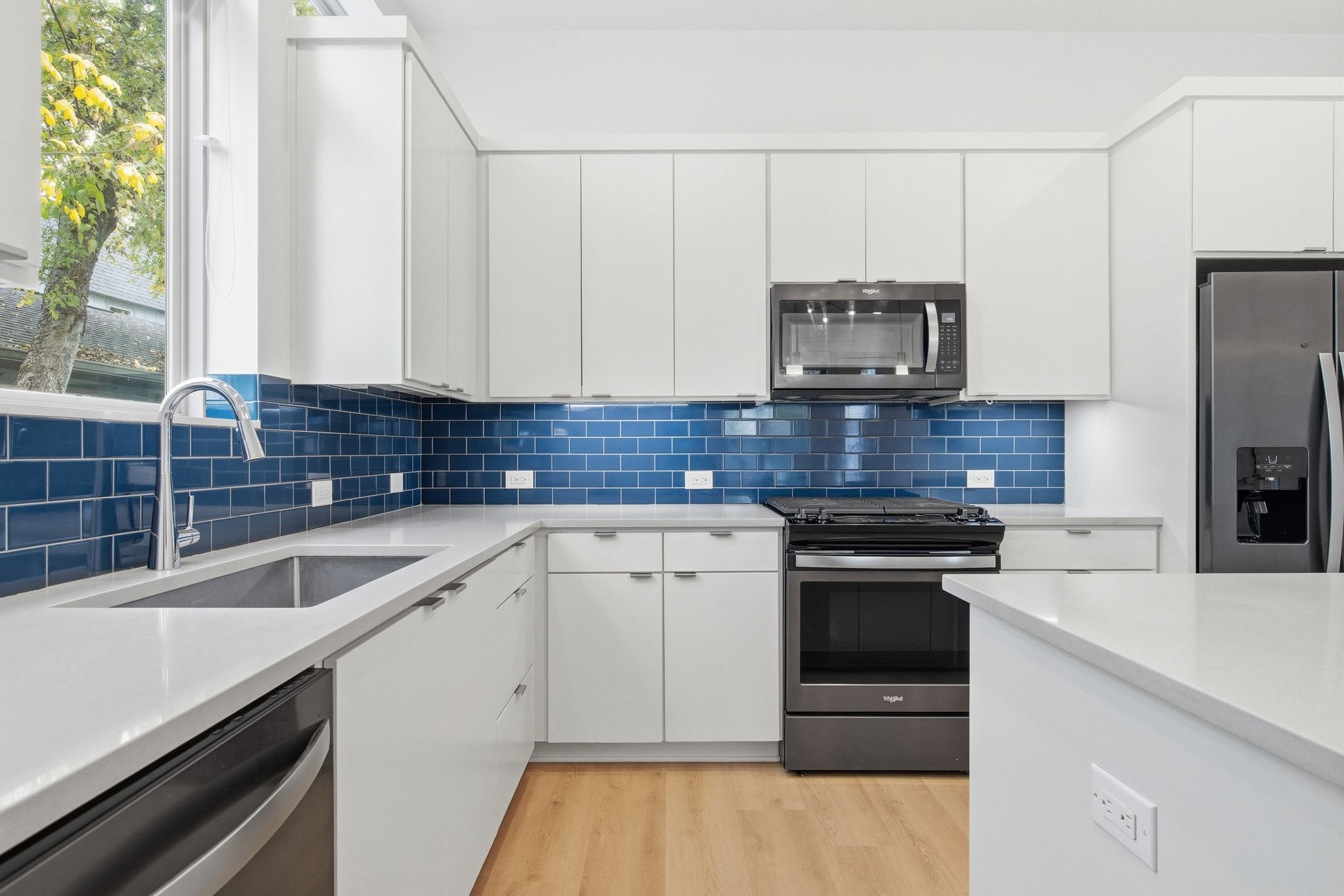 2811 Garwood Street, Unit A Austin, TX 78702 - Photo 14 of 27 a kitchen with a sink stove and refrigerator