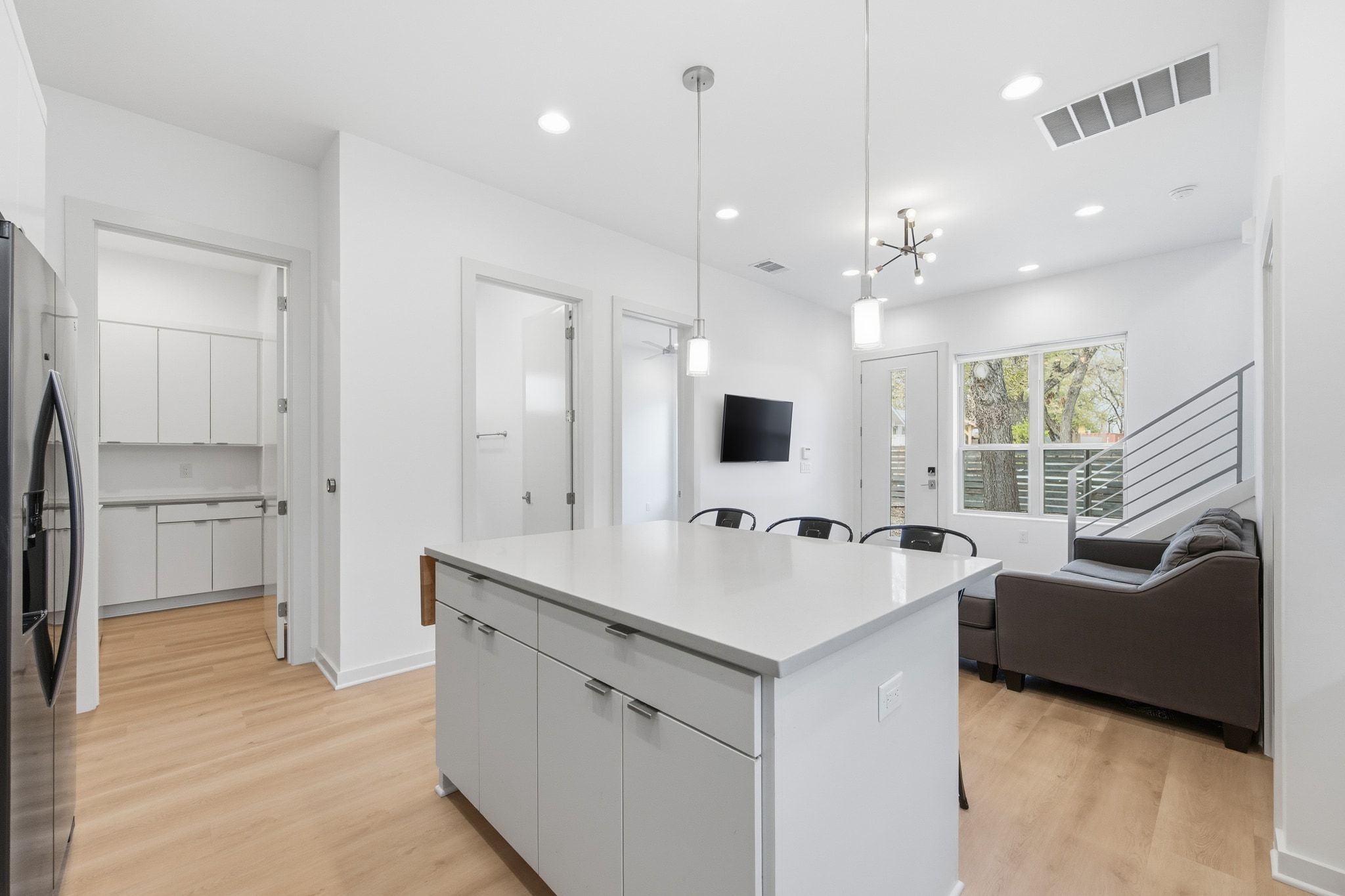 2811 Garwood Street, Unit A Austin, TX 78702 - Photo 16 of 27 a room with a sink a flat screen tv and a couch