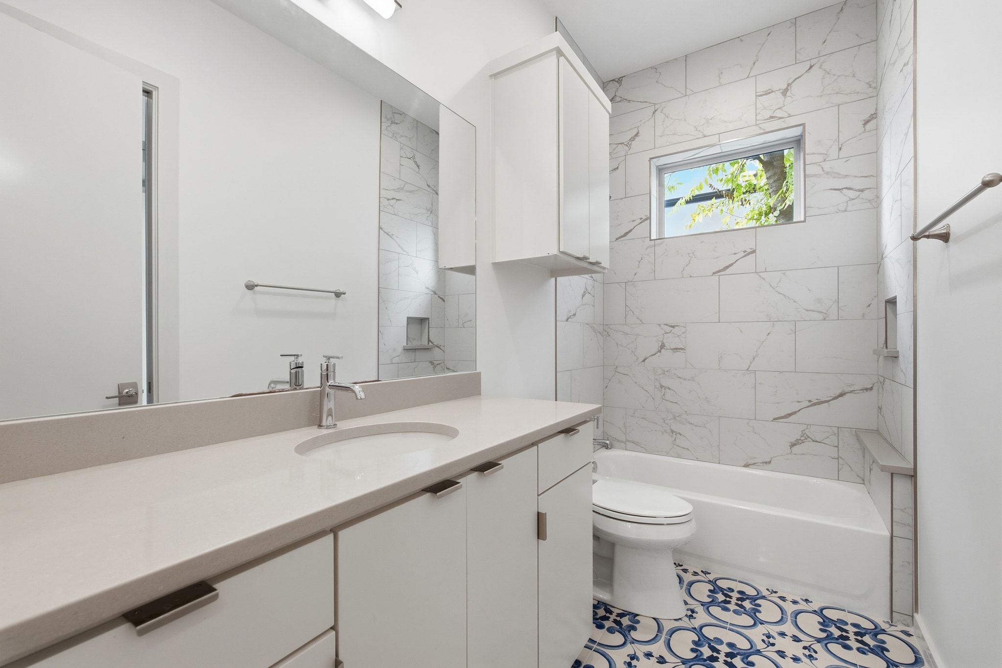 2811 Garwood Street, Unit A Austin, TX 78702 - Photo 19 of 27 a bathroom with a sink a toilet and a bathtub
