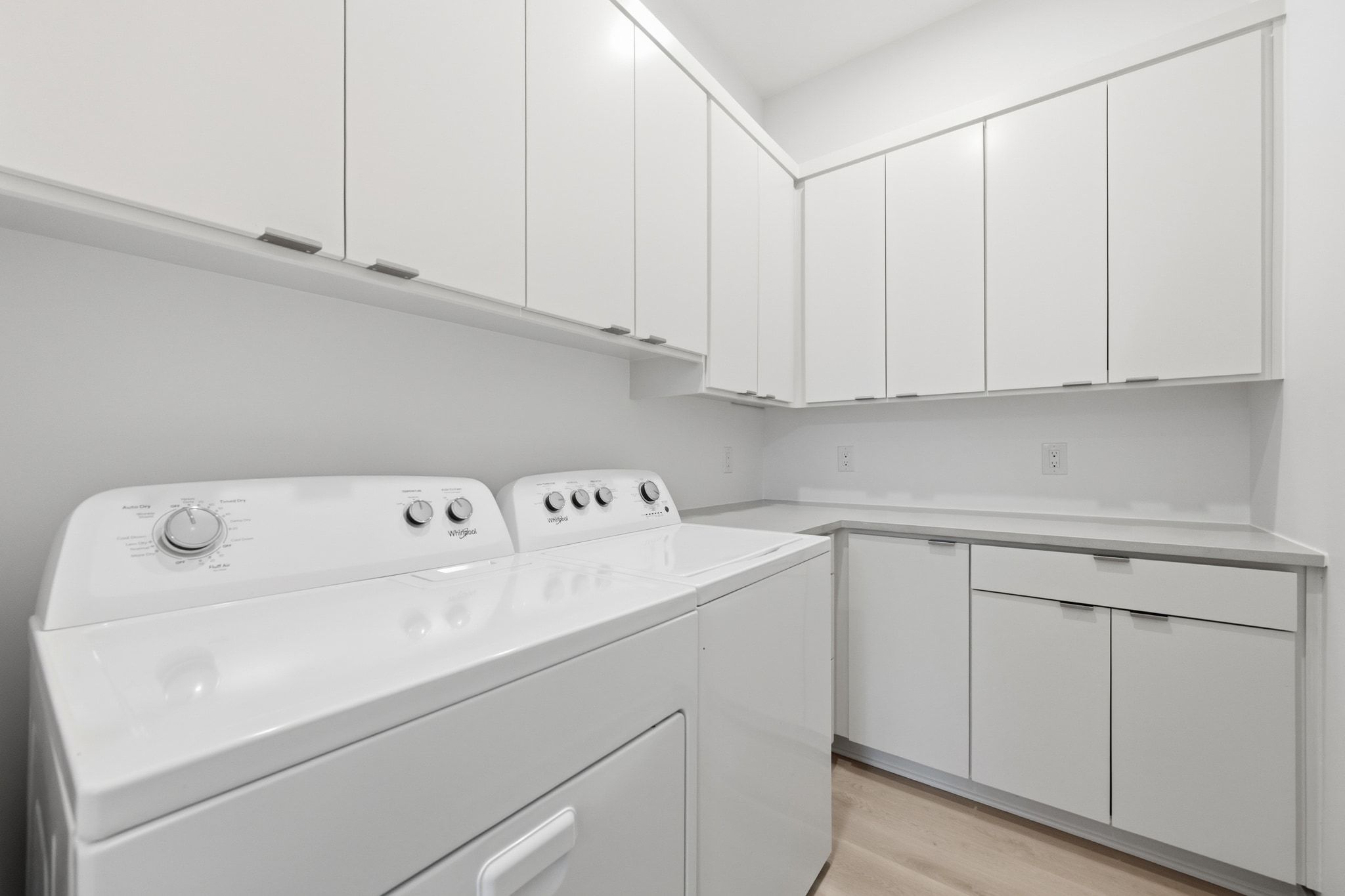 2811 Garwood Street, Unit A Austin, TX 78702 - Photo 20 of 27 a utility room with dryer and cabinets