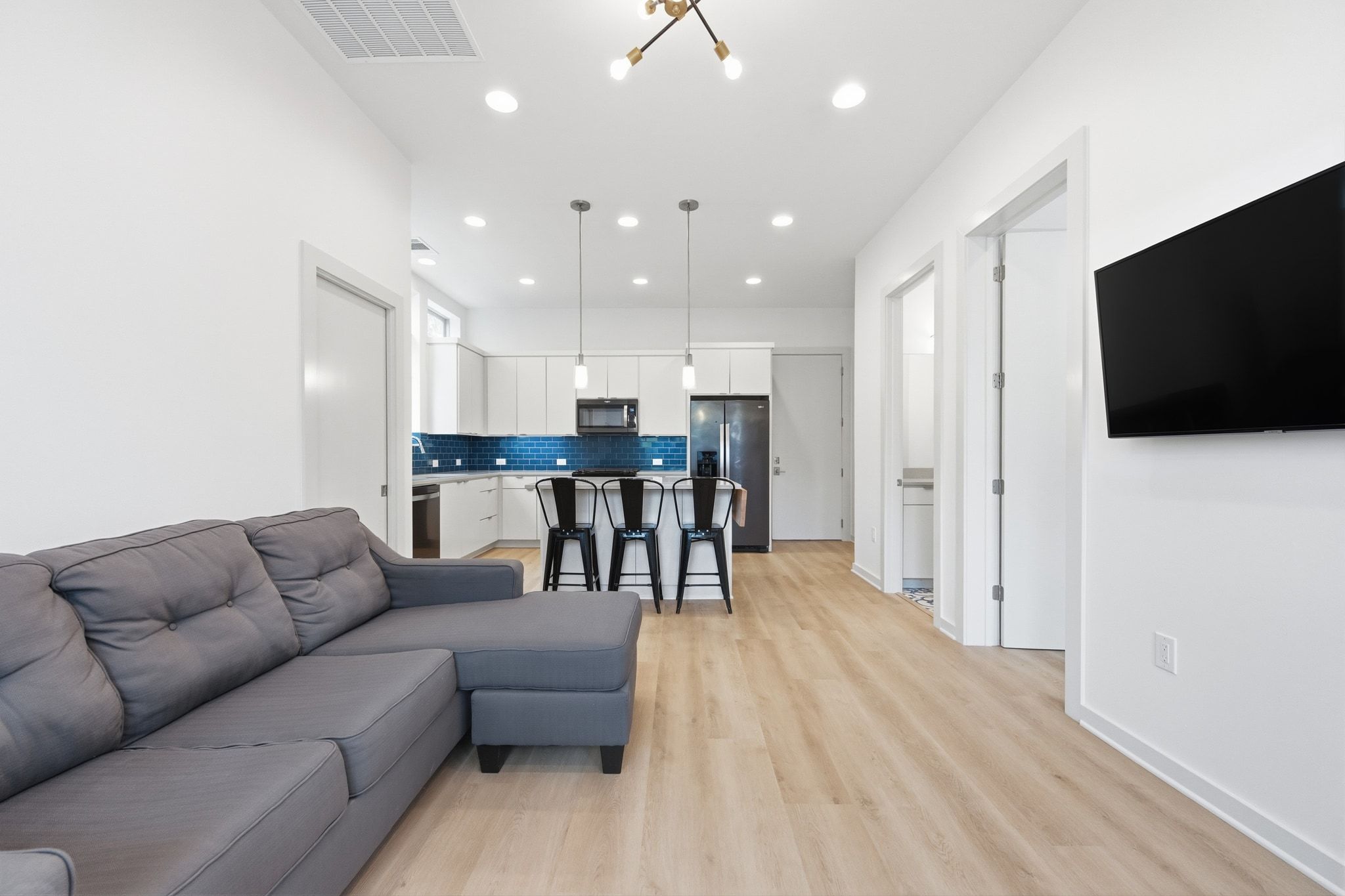 2811 Garwood Street, Unit A Austin, TX 78702 - Photo 10 of 27 a living room with furniture and a flat screen tv