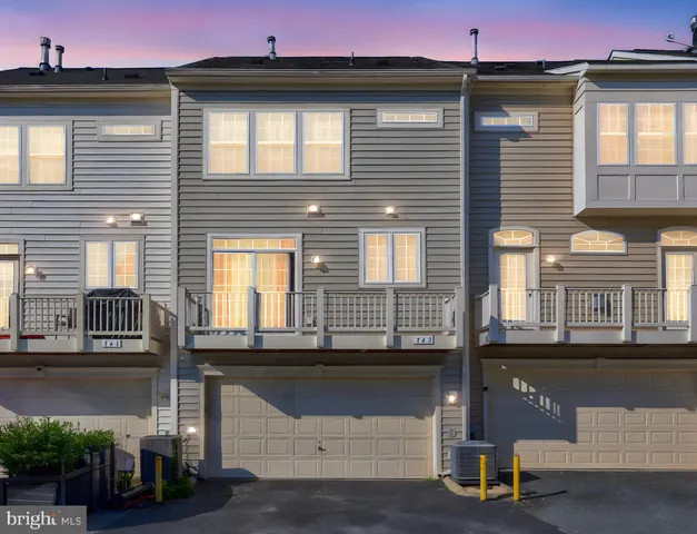 a front view of a house with a parking