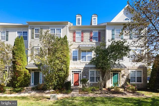 a front view of a house with yard porch and furniture
