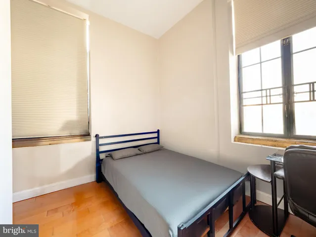 a view of a room with furniture and a window