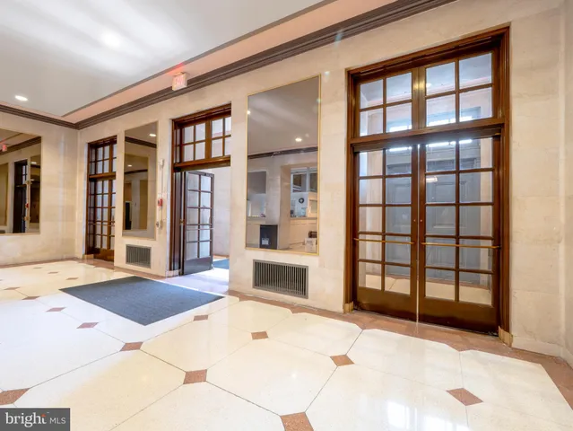 a view of a livingroom with wooden floor and furniture
