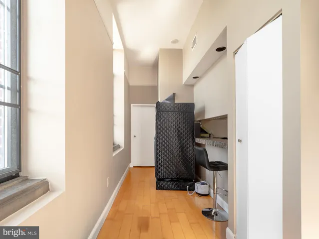 a view of a building with car parked