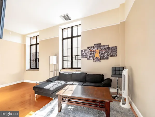 a living room with furniture and a window