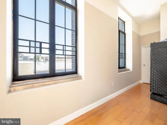 a view of an empty room with windows