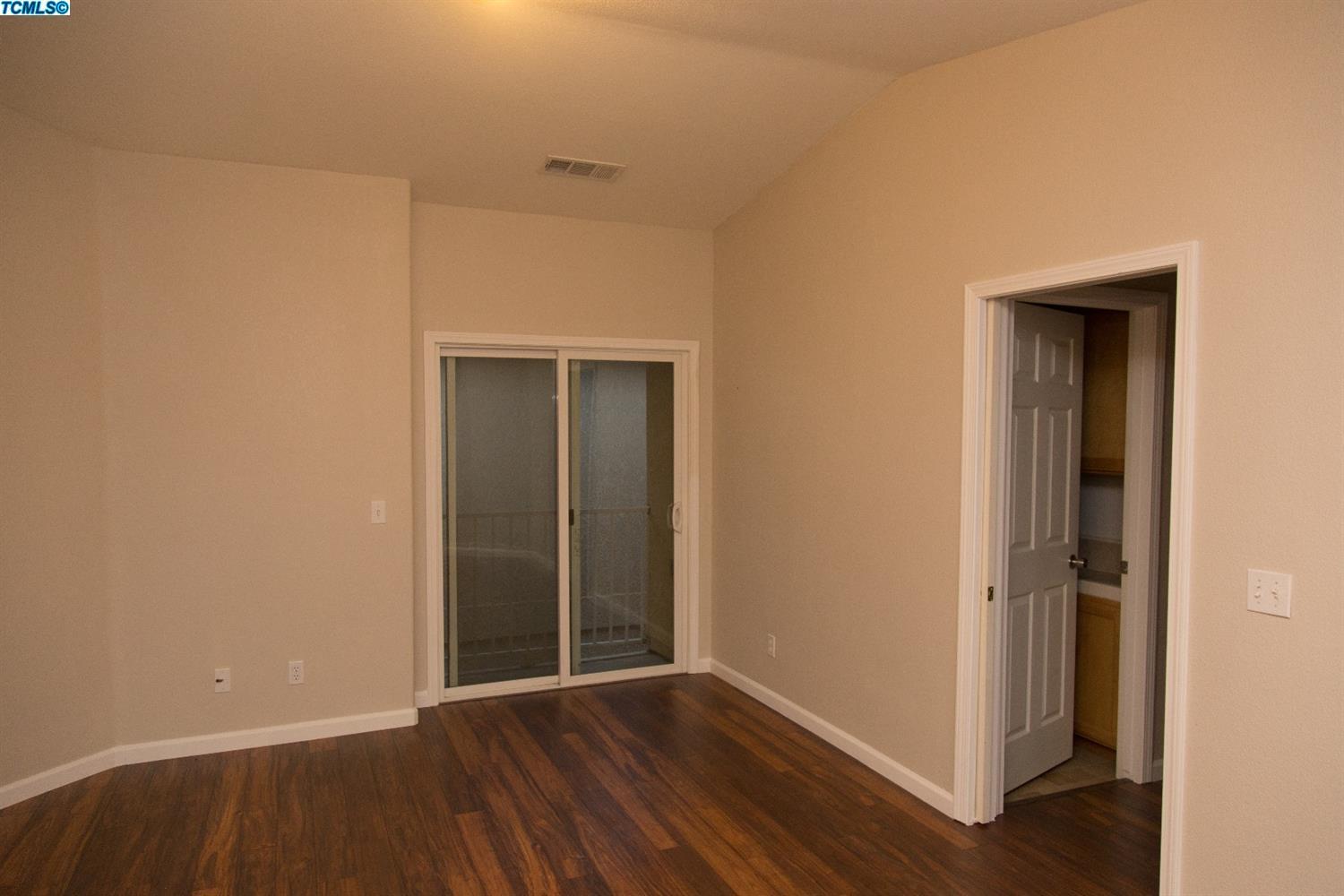 148 South Filbert Road Exeter, CA 93221 - Photo 10 of 23 a view of an empty room with wooden floor and closet