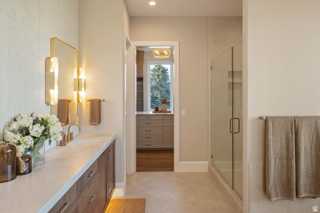4292 Silver Sage Circle Alpine, UT 84004 - Photo 15 of 41 Bathroom vanity with a white countertop and dark wood-finish cabinetry, featuring a mounted rectangular mirror with integrated lighting