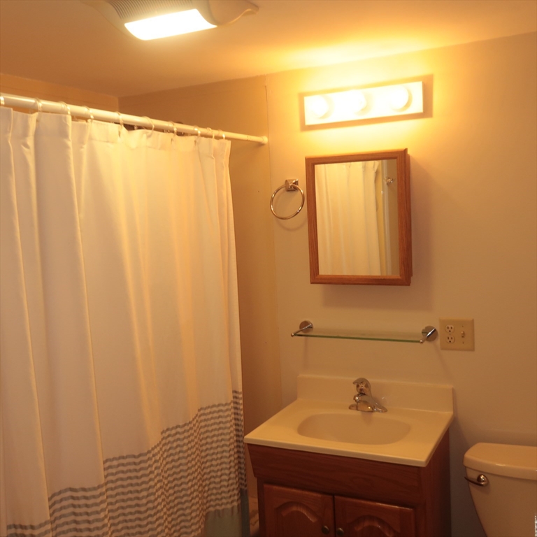 1 Atkinson Drive, Unit 3 Saugus, MA 01906 - Photo 12 of 27 a bathroom with a sink and a mirror