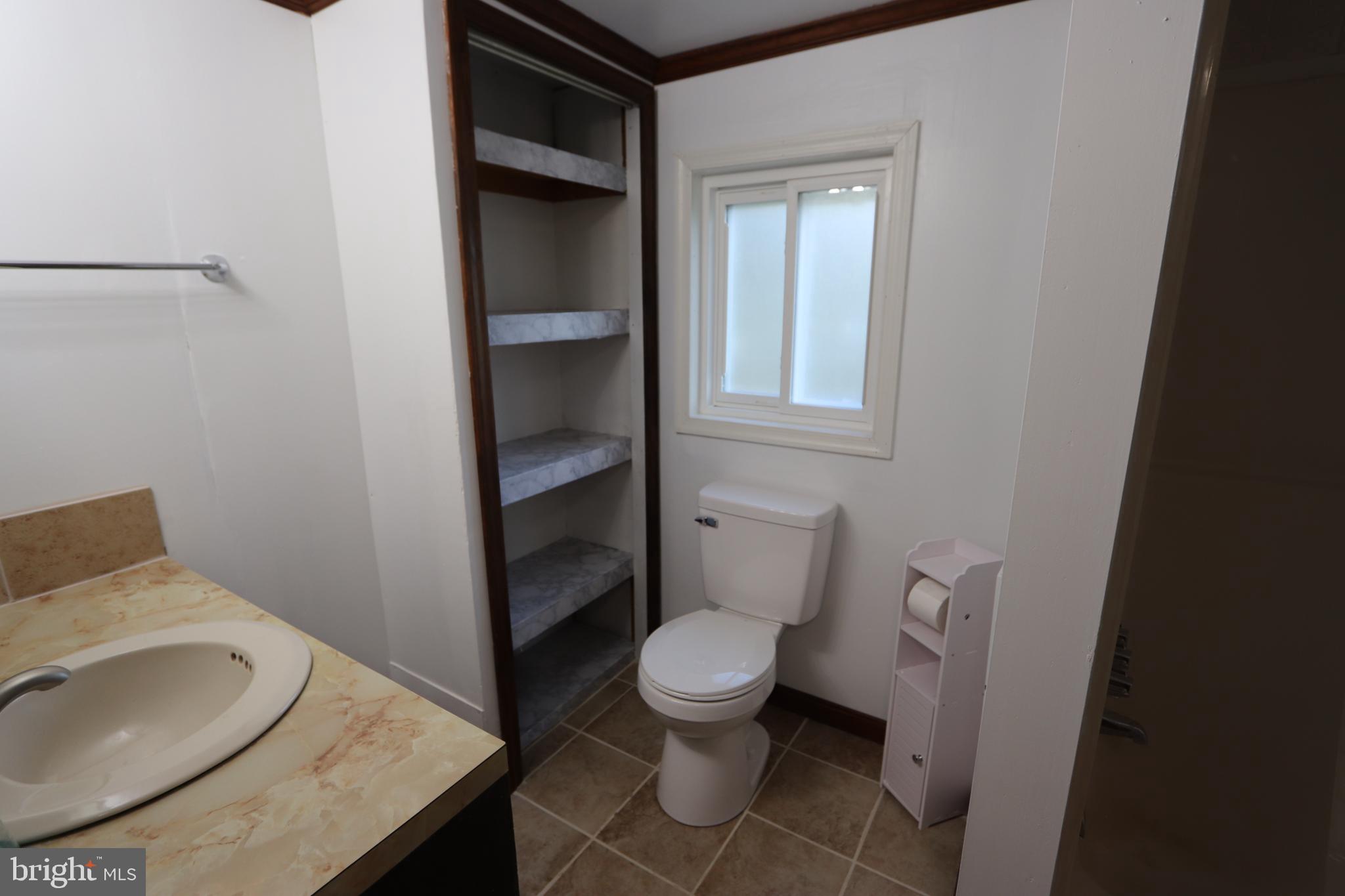 9540 Greenfield Road La Plata, MD 20646 - Photo 15 of 33 a bathroom with a toilet and a sink