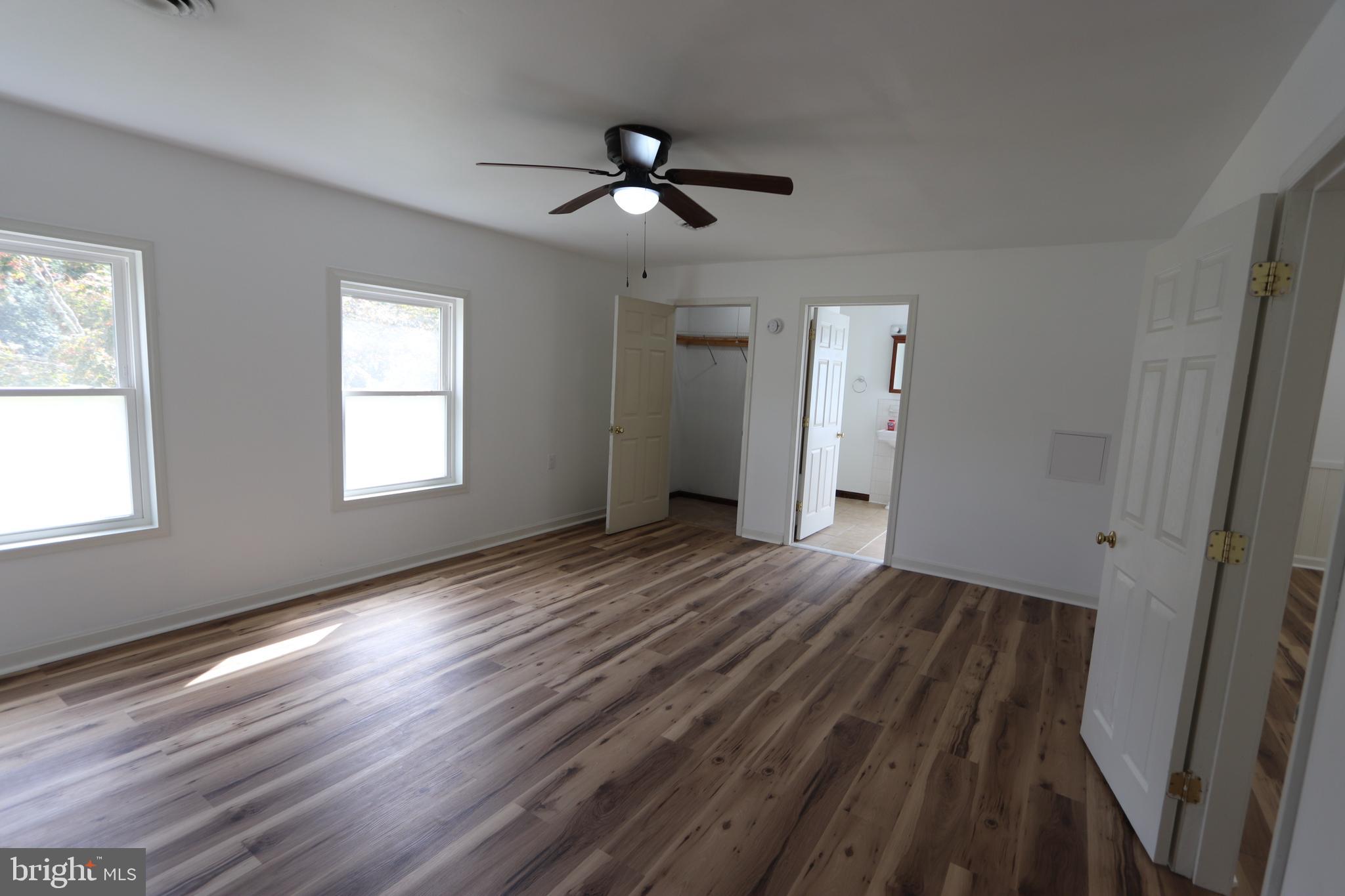9540 Greenfield Road La Plata, MD 20646 - Photo 6 of 33 a view of an empty room with wooden floor and a window