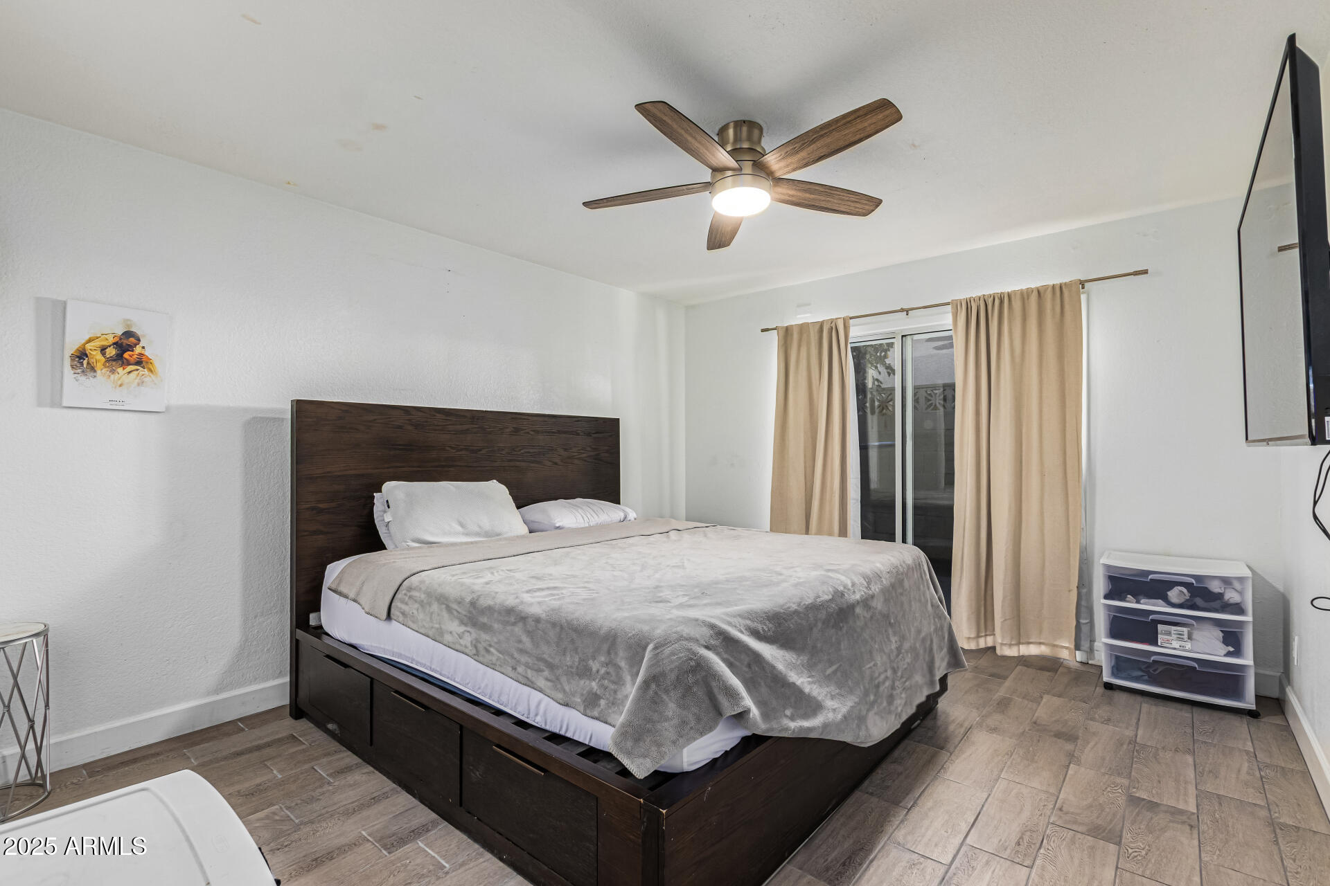 2934 North 22nd Place Phoenix, AZ 85016 - Photo 13 of 27 a bedroom with a bed and a ceiling fan