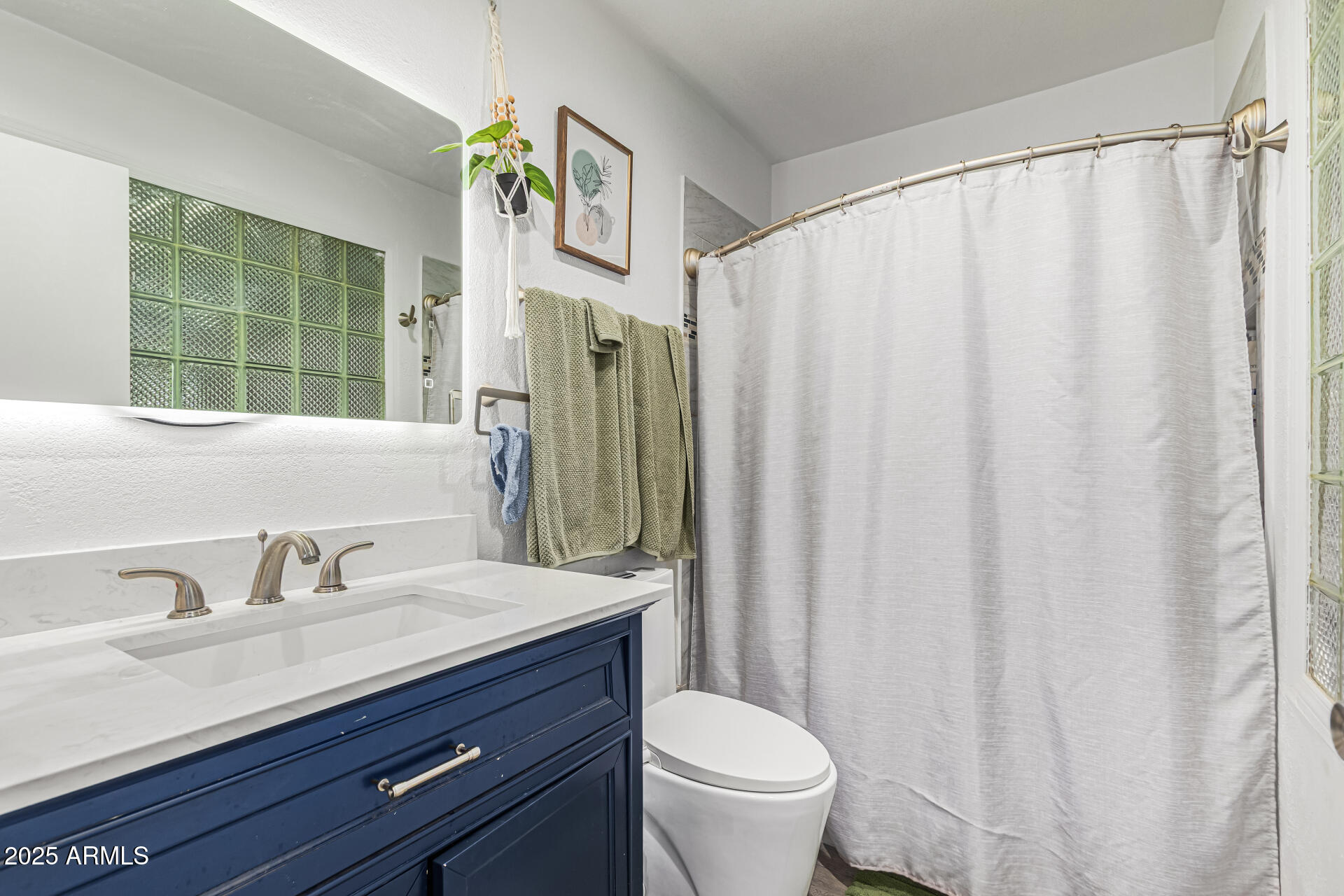 2934 North 22nd Place Phoenix, AZ 85016 - Photo 16 of 27 a bathroom with a sink and a mirror