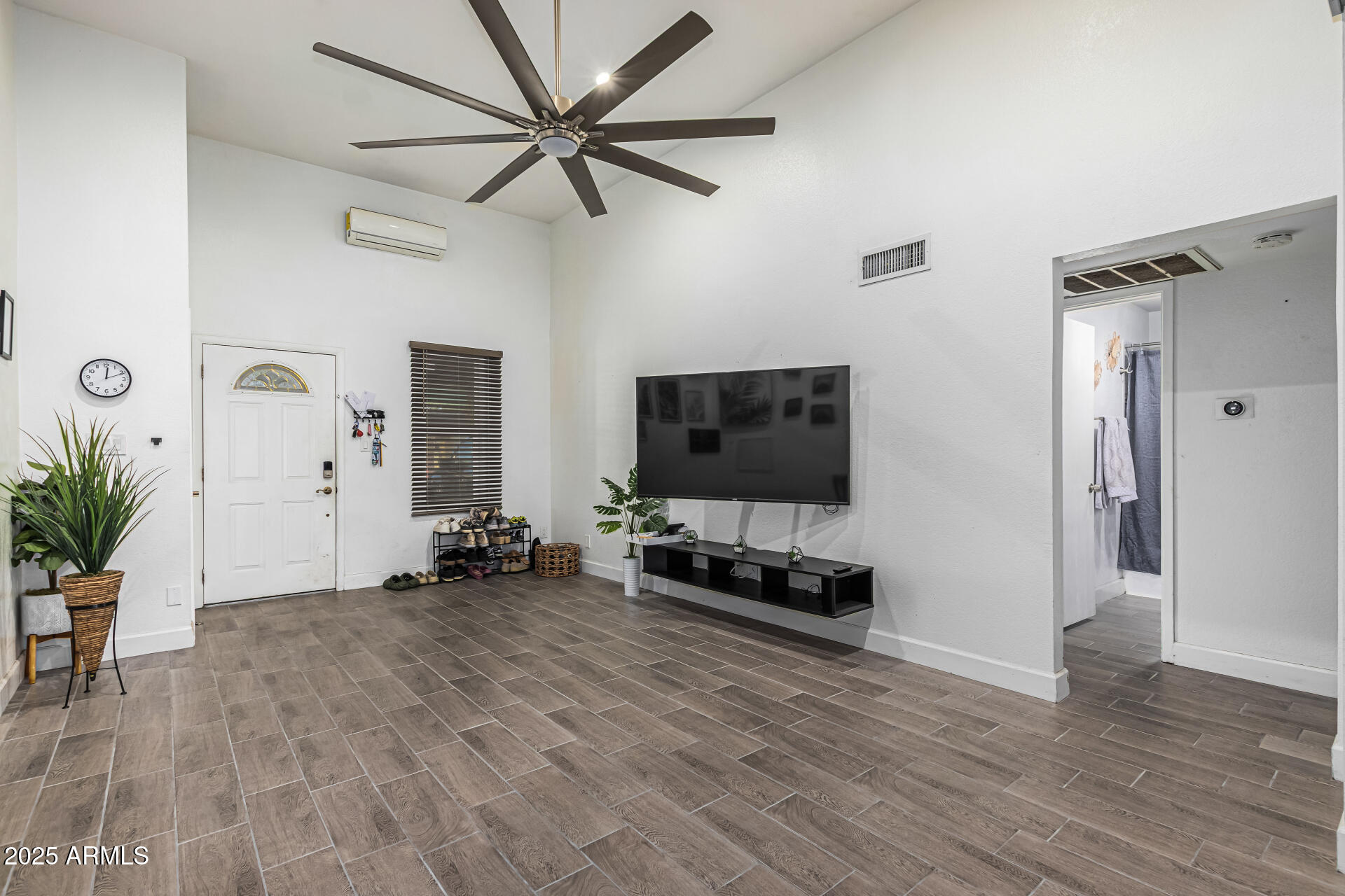 2934 North 22nd Place Phoenix, AZ 85016 - Photo 4 of 27 a living room with furniture and a flat screen tv