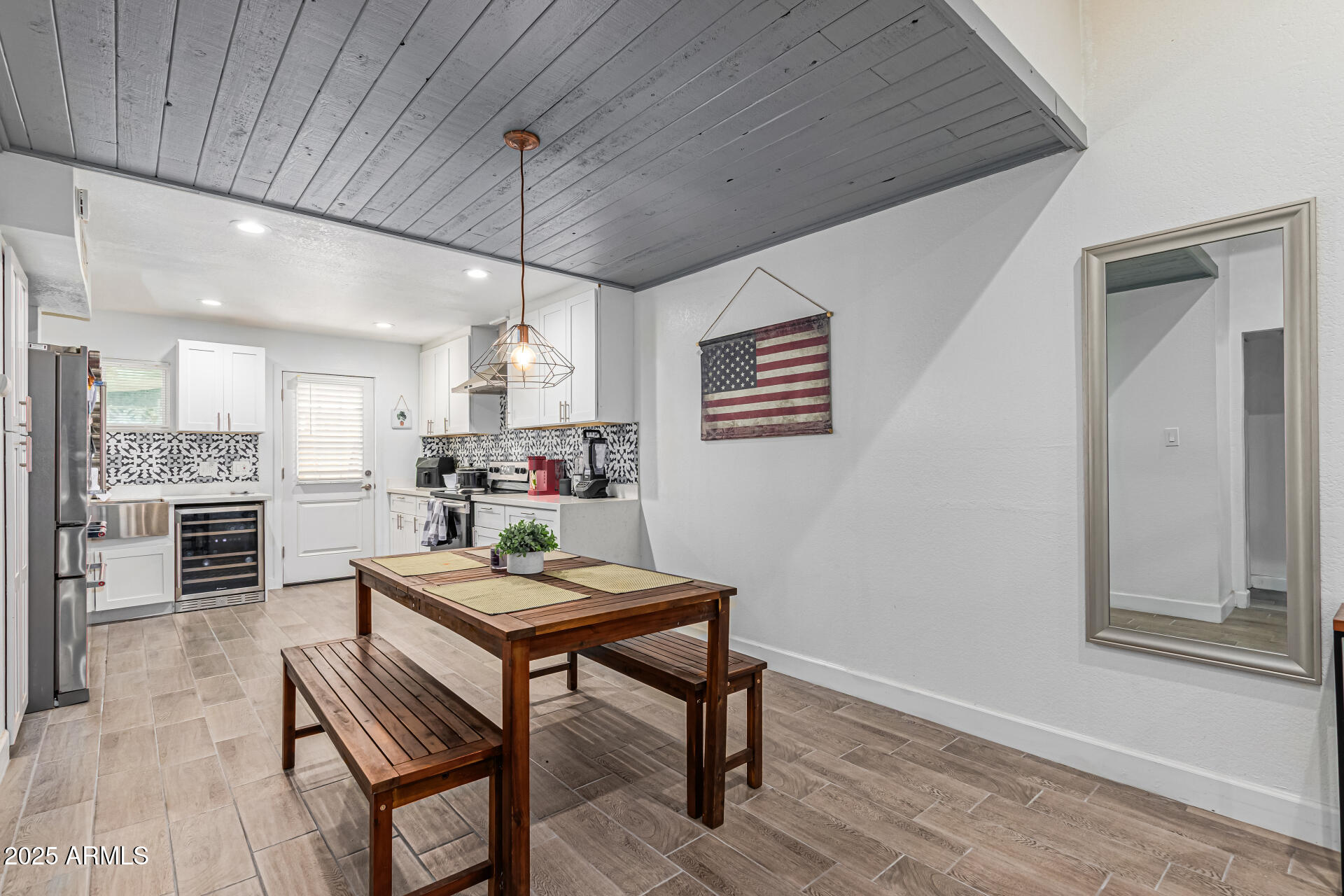 2934 North 22nd Place Phoenix, AZ 85016 - Photo 7 of 27 a kitchen with a table and chairs in it
