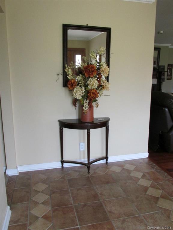 902 Tomberlin Road Monroe, NC 28110 - Photo 2 of 21 a view of a bathroom with a potted plant on a counter and a shower