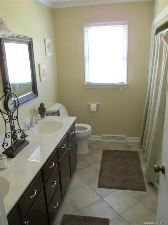 902 Tomberlin Road Monroe, NC 28110 - Photo 12 of 21 a bathroom with a sink and a mirror