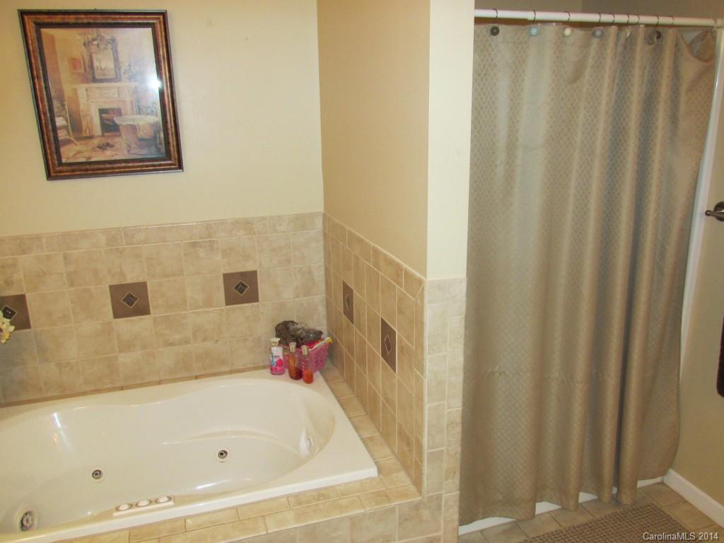 902 Tomberlin Road Monroe, NC 28110 - Photo 15 of 21 a bathroom with a bathtub