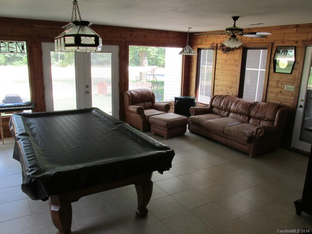 902 Tomberlin Road Monroe, NC 28110 - Photo 16 of 21 a living room with furniture and a chandelier