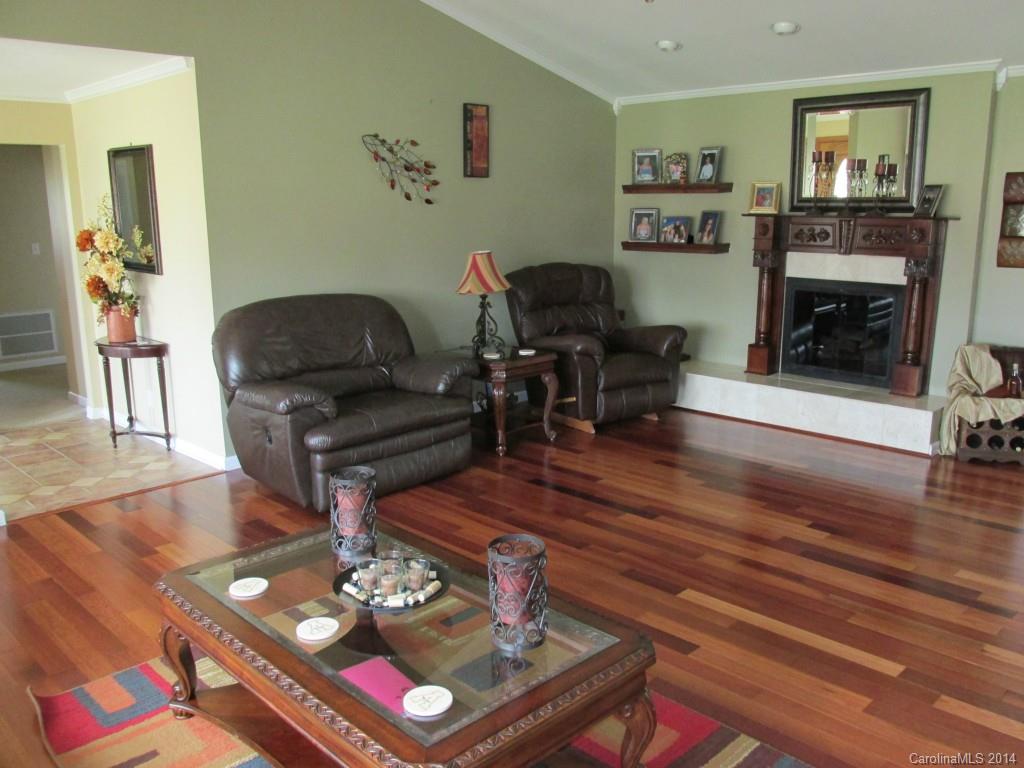 902 Tomberlin Road Monroe, NC 28110 - Photo 3 of 21 a living room with furniture and a fireplace