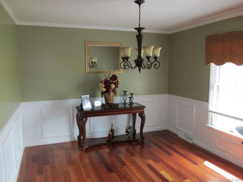 902 Tomberlin Road Monroe, NC 28110 - Photo 5 of 21 a view of a room with wooden floor and windows
