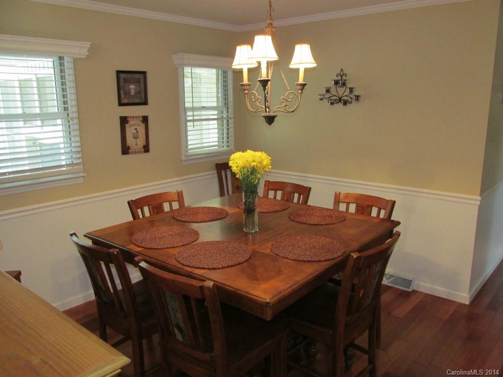 902 Tomberlin Road Monroe, NC 28110 - Photo 8 of 21 a view of a dining room with furniture and chandelier