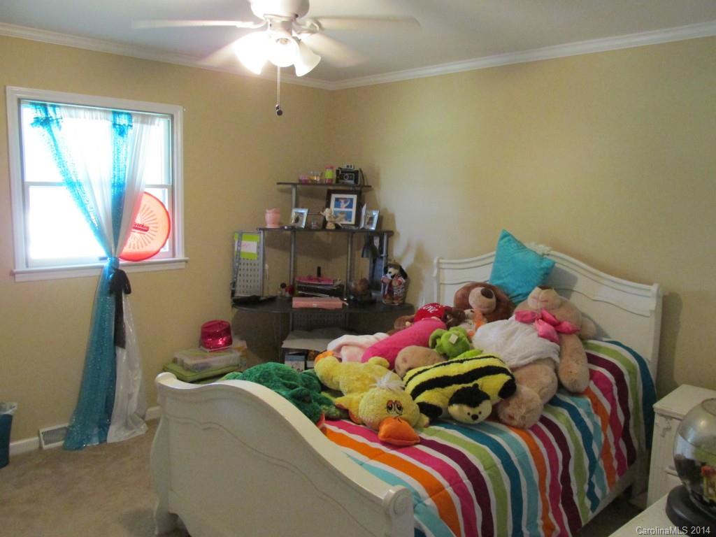 902 Tomberlin Road Monroe, NC 28110 - Photo 9 of 21 a bedroom with a bed and a window