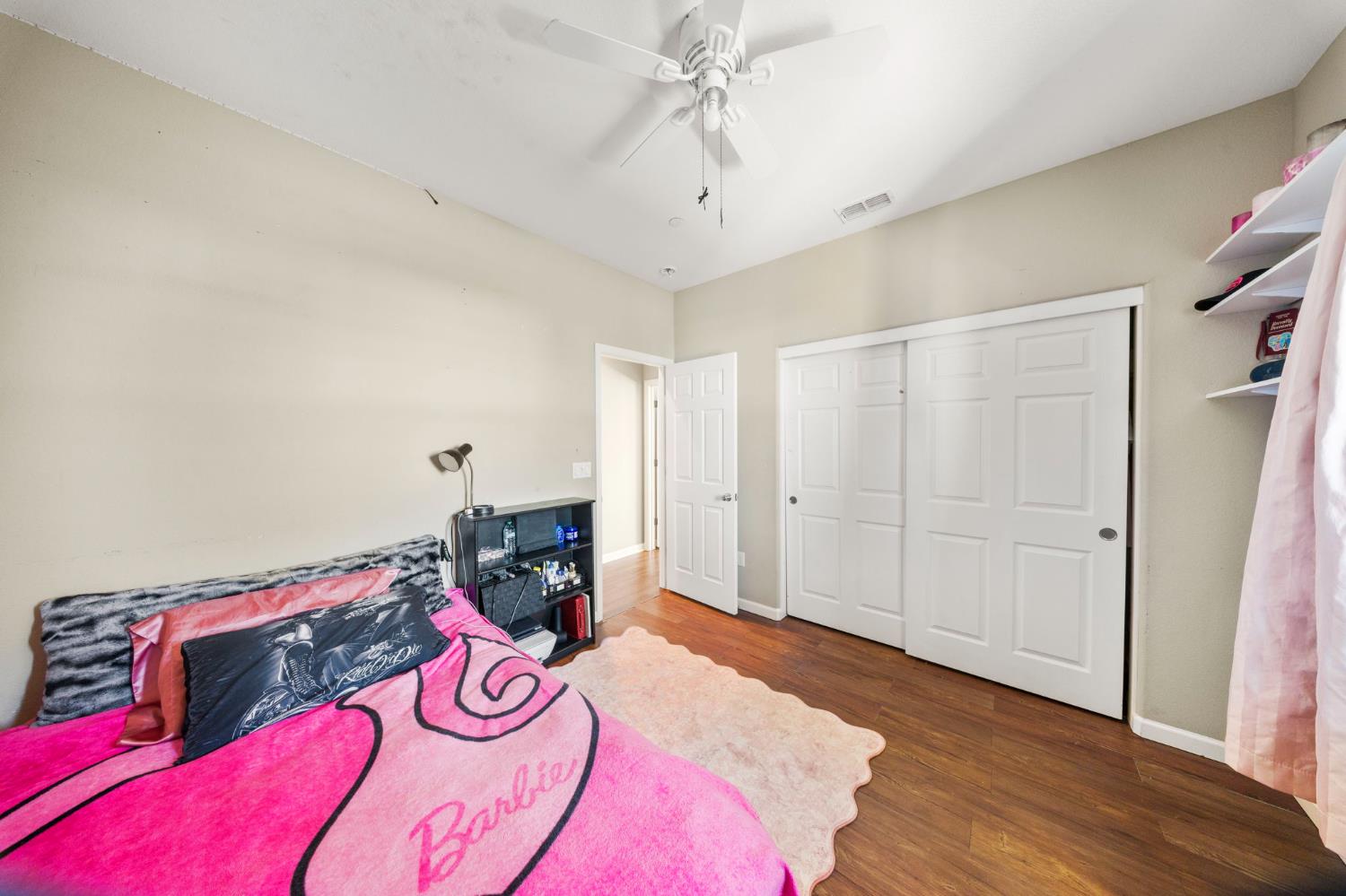 2685 Remy Javier Street Tracy, CA 95377 - Photo 15 of 26 a bedroom with a bed and a chandelier