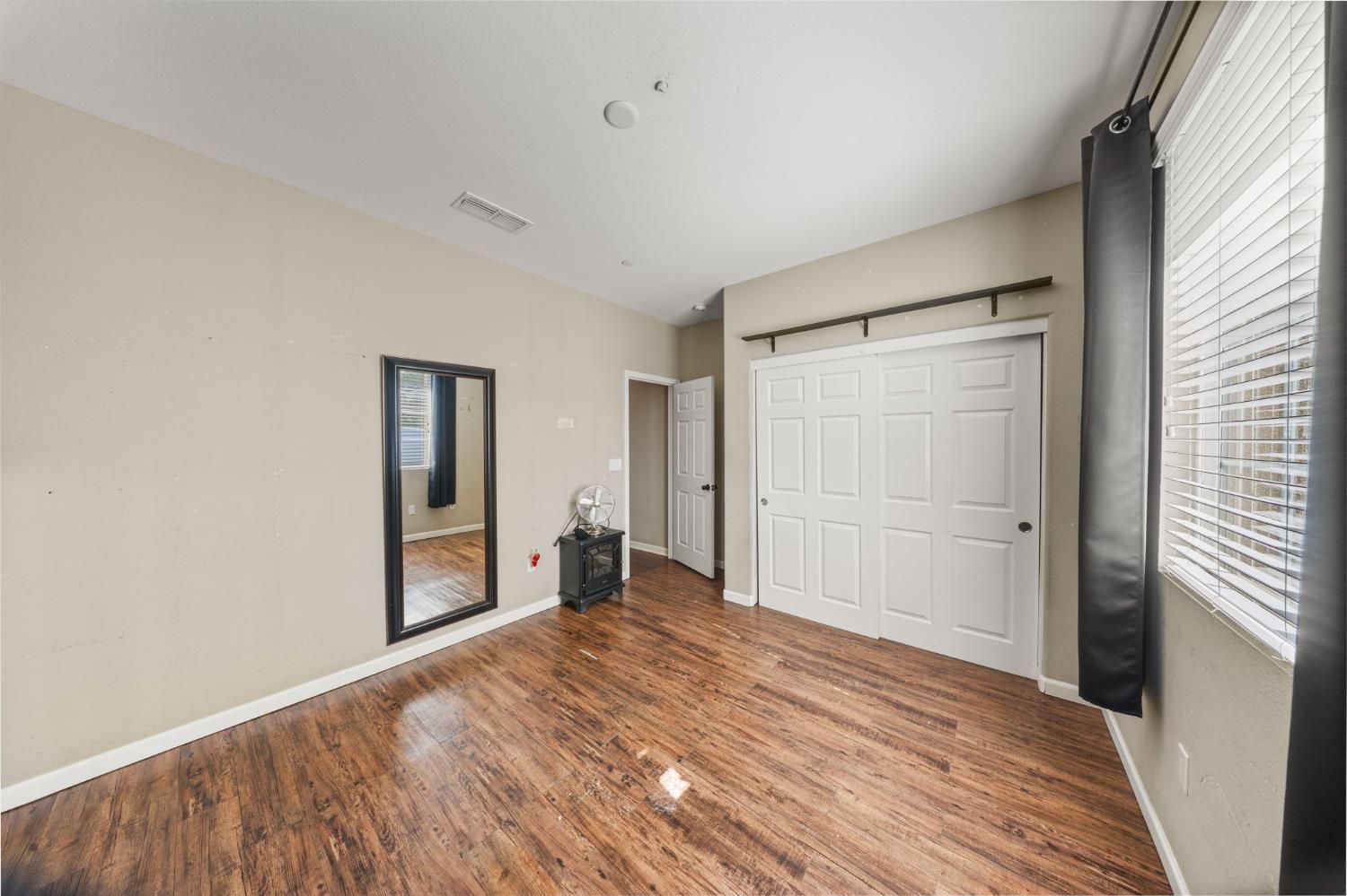 2685 Remy Javier Street Tracy, CA 95377 - Photo 17 of 26 a view of a livingroom with wooden floor and closet