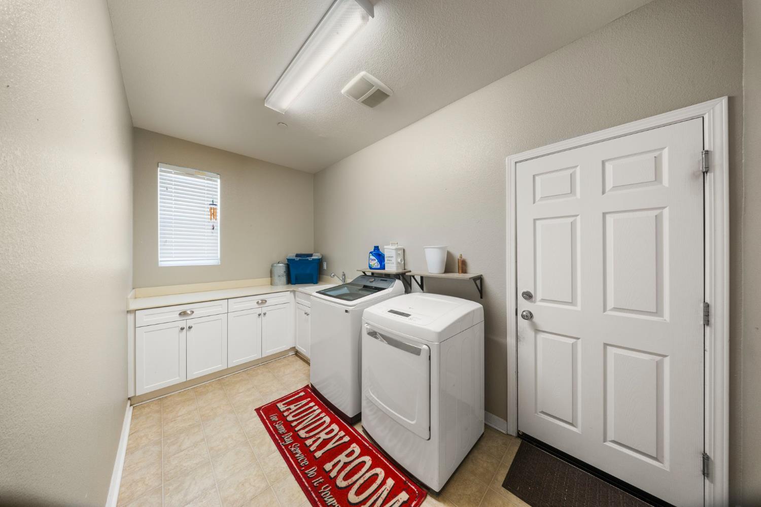 2685 Remy Javier Street Tracy, CA 95377 - Photo 18 of 26 a utility room with dryer and washer