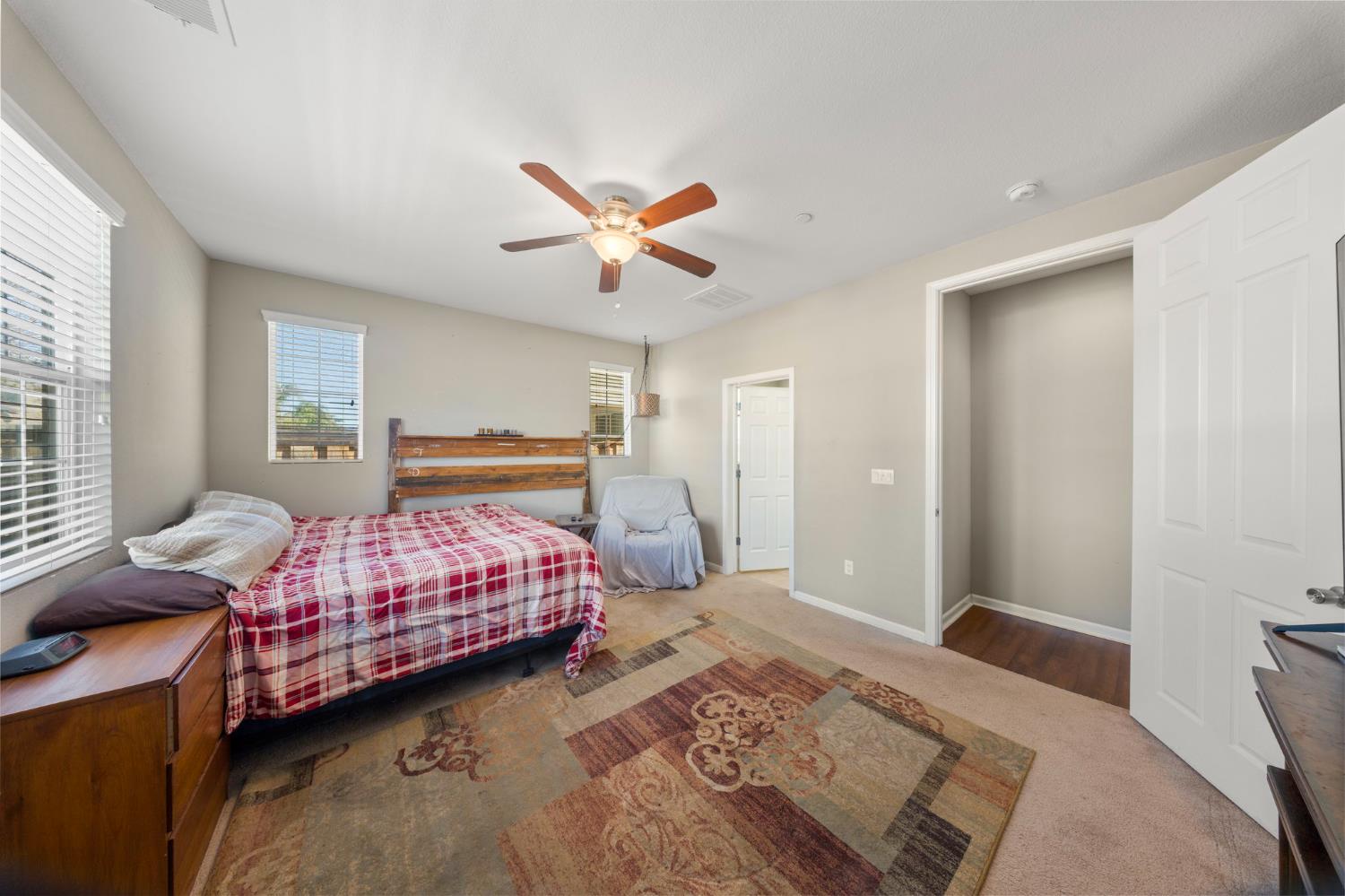 2685 Remy Javier Street Tracy, CA 95377 - Photo 20 of 26 a bedroom with a bed and a chandelier
