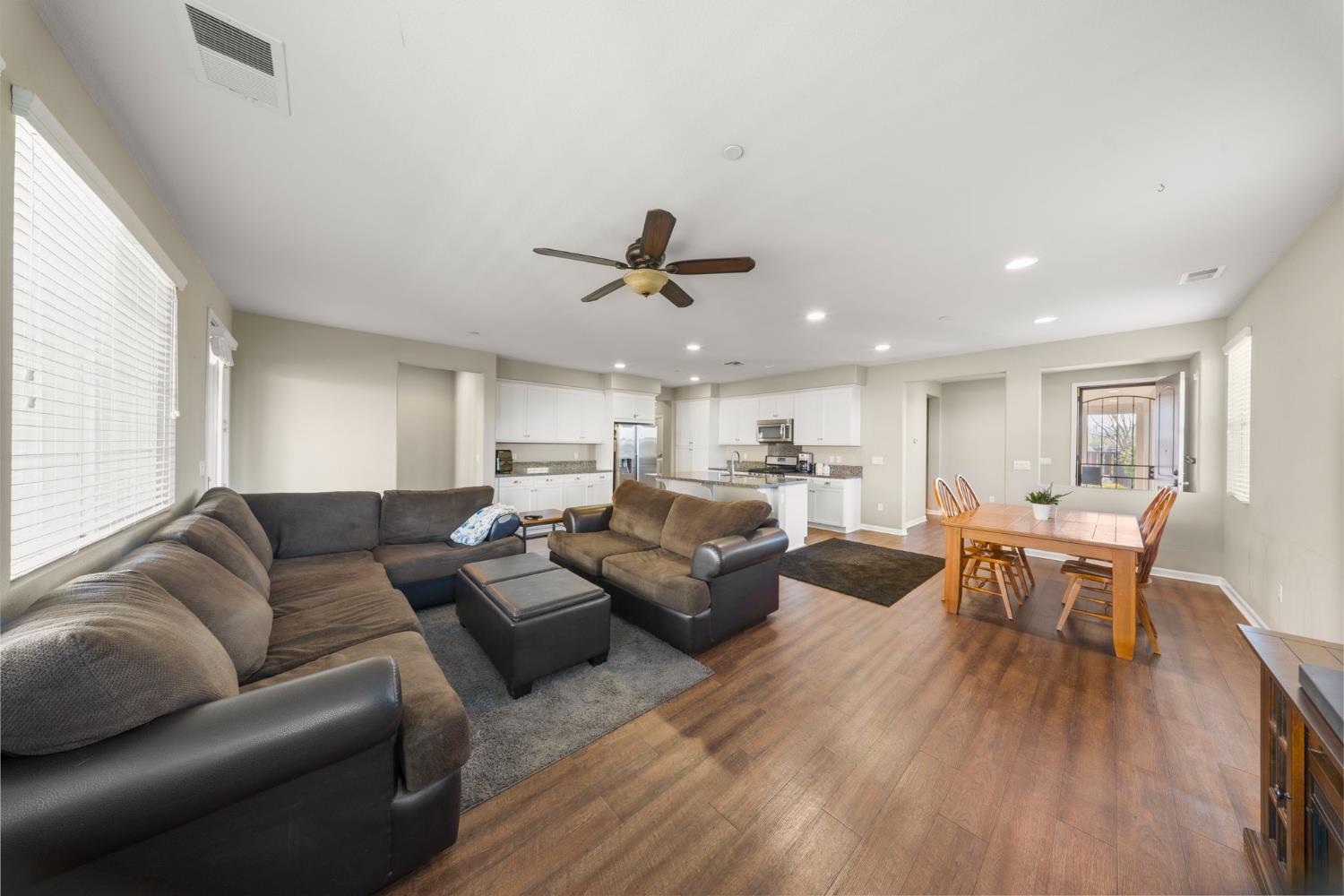 2685 Remy Javier Street Tracy, CA 95377 - Photo 6 of 26 a living room with furniture kitchen view and a wooden floor