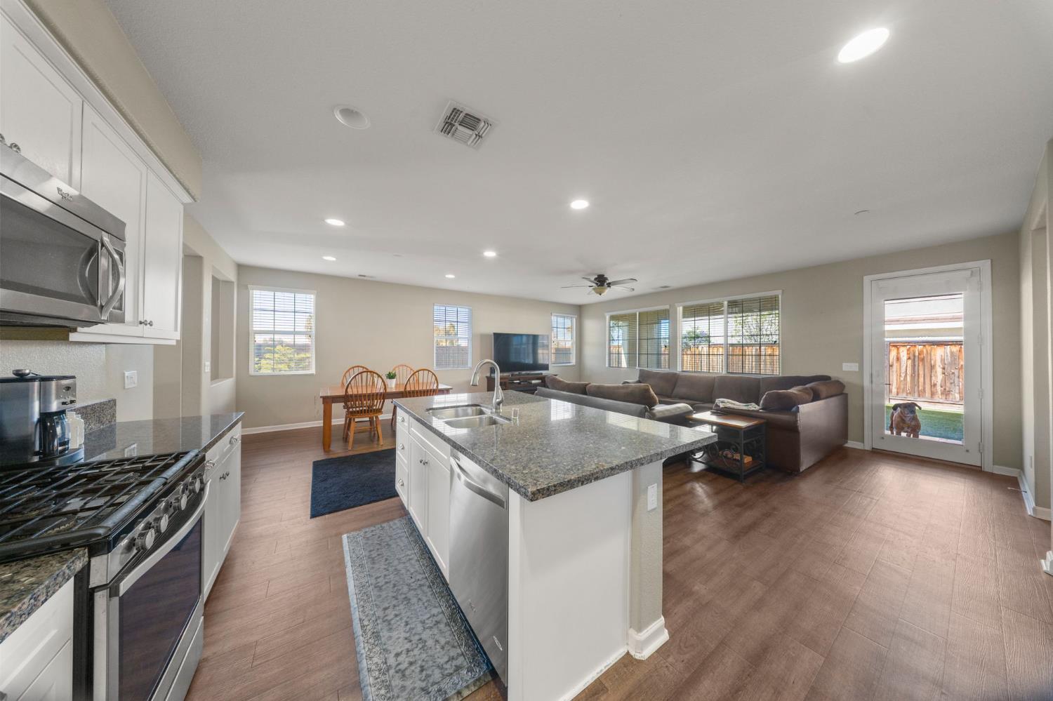 2685 Remy Javier Street Tracy, CA 95377 - Photo 8 of 26 a kitchen with sink stove and cabinets