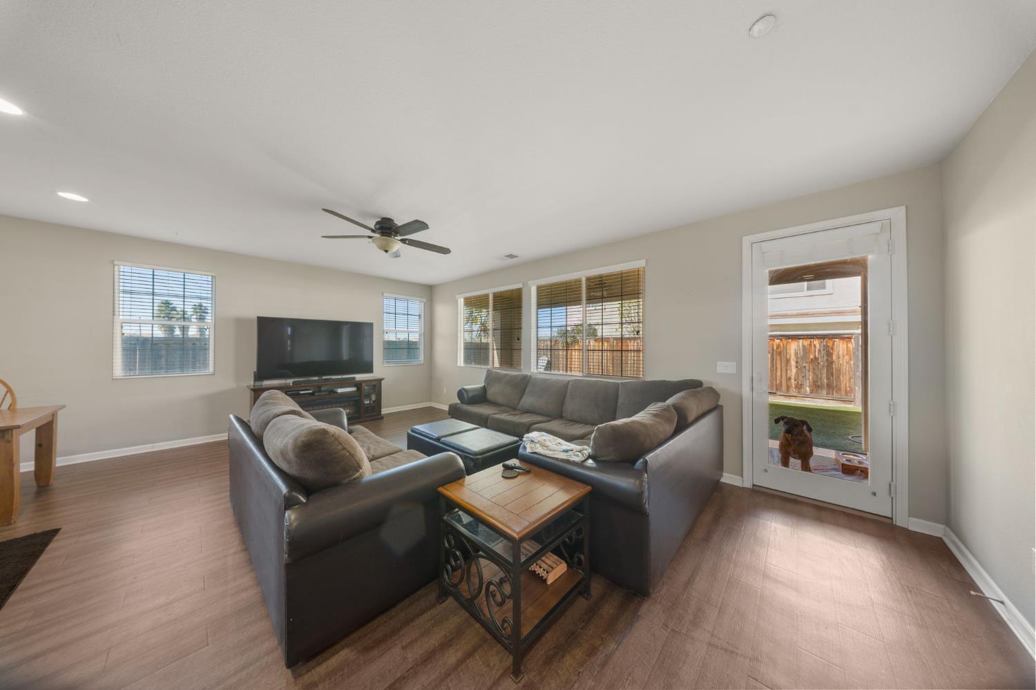 2685 Remy Javier Street Tracy, CA 95377 - Photo 9 of 26 a living room with furniture a flat screen tv and a window