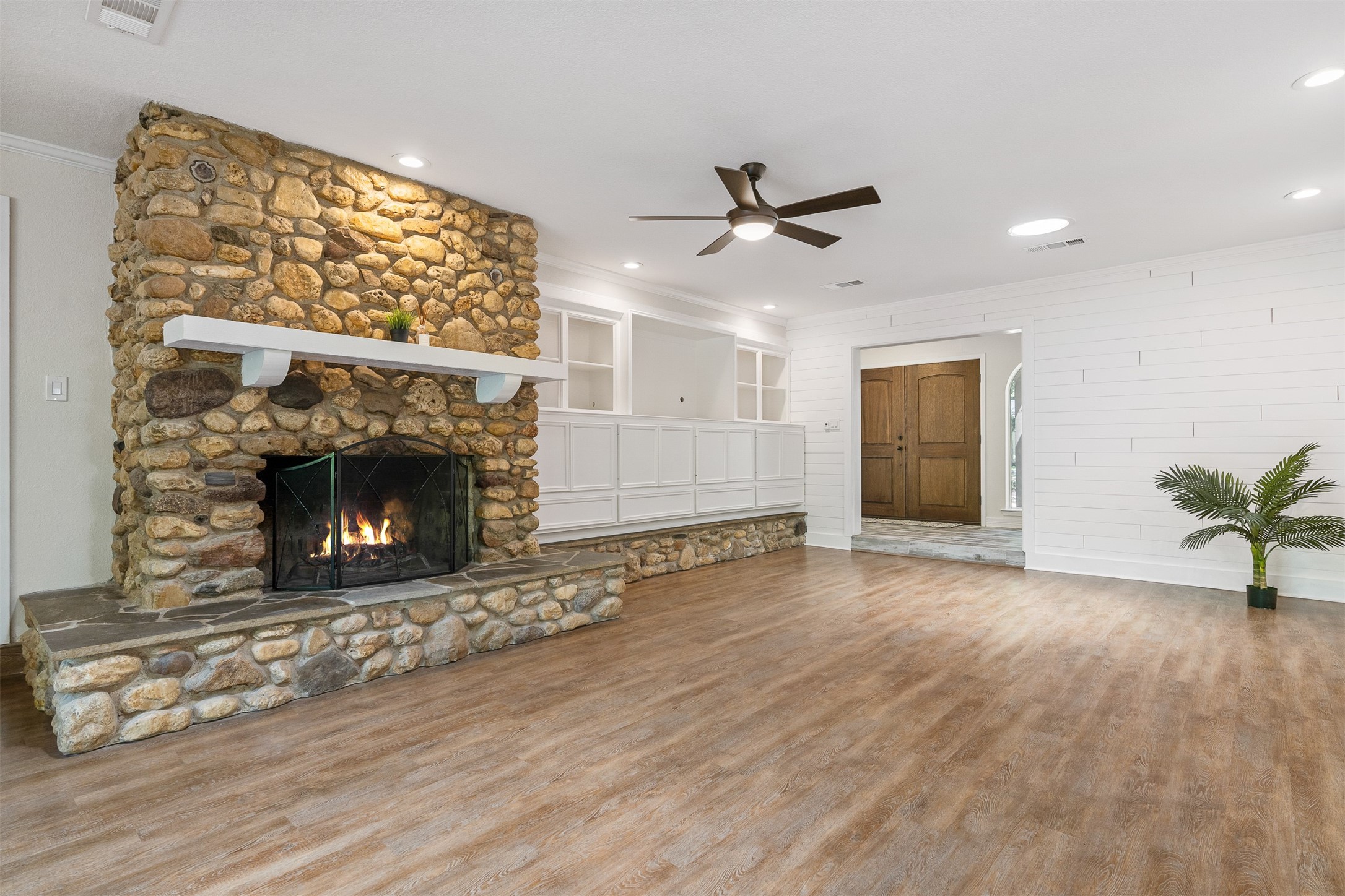 3219 Chippers Crossing Montgomery, TX 77356 - Photo 11 of 35 a view of empty room with wooden floor and a fireplace