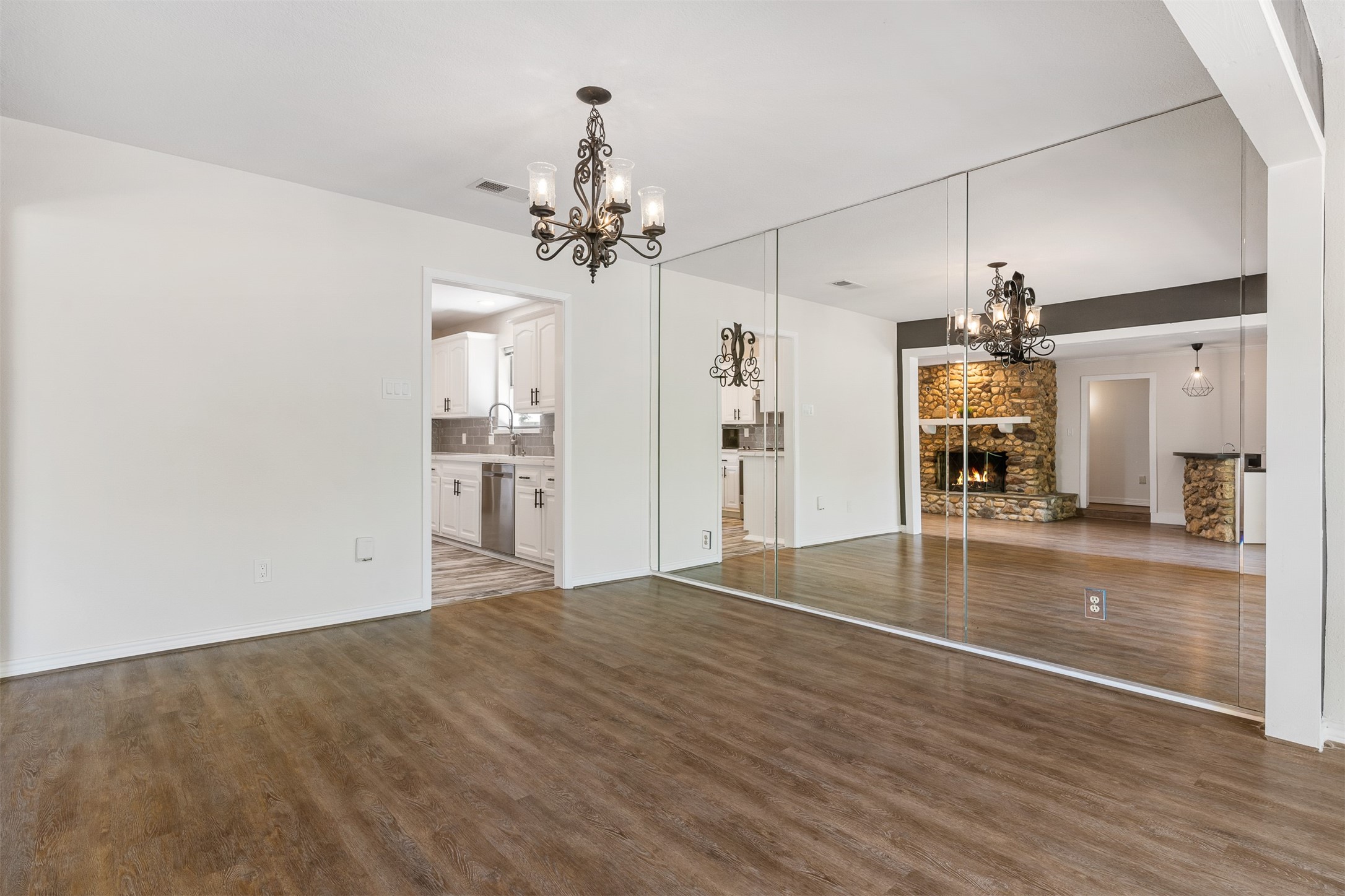 3219 Chippers Crossing Montgomery, TX 77356 - Photo 15 of 35 a view of a kitchen with wooden floor and a kitchen island