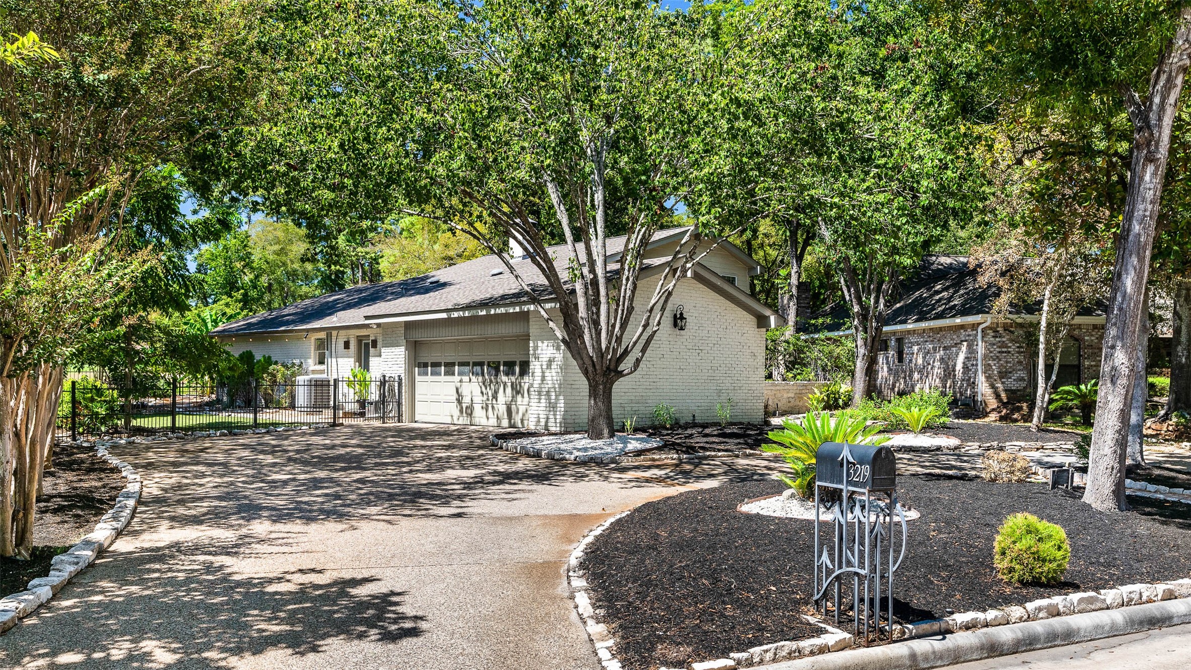 3219 Chippers Crossing Montgomery, TX 77356 - Photo 2 of 35 a front view of a house with yard and trees
