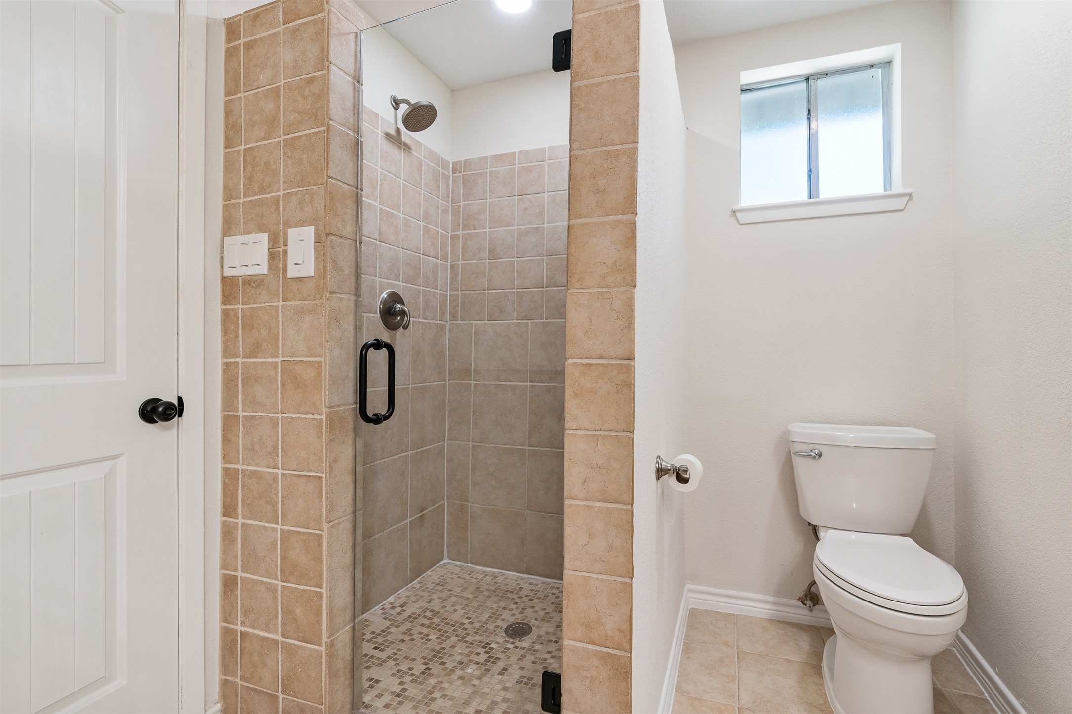 3219 Chippers Crossing Montgomery, TX 77356 - Photo 21 of 35 a bathroom with a toilet and shower