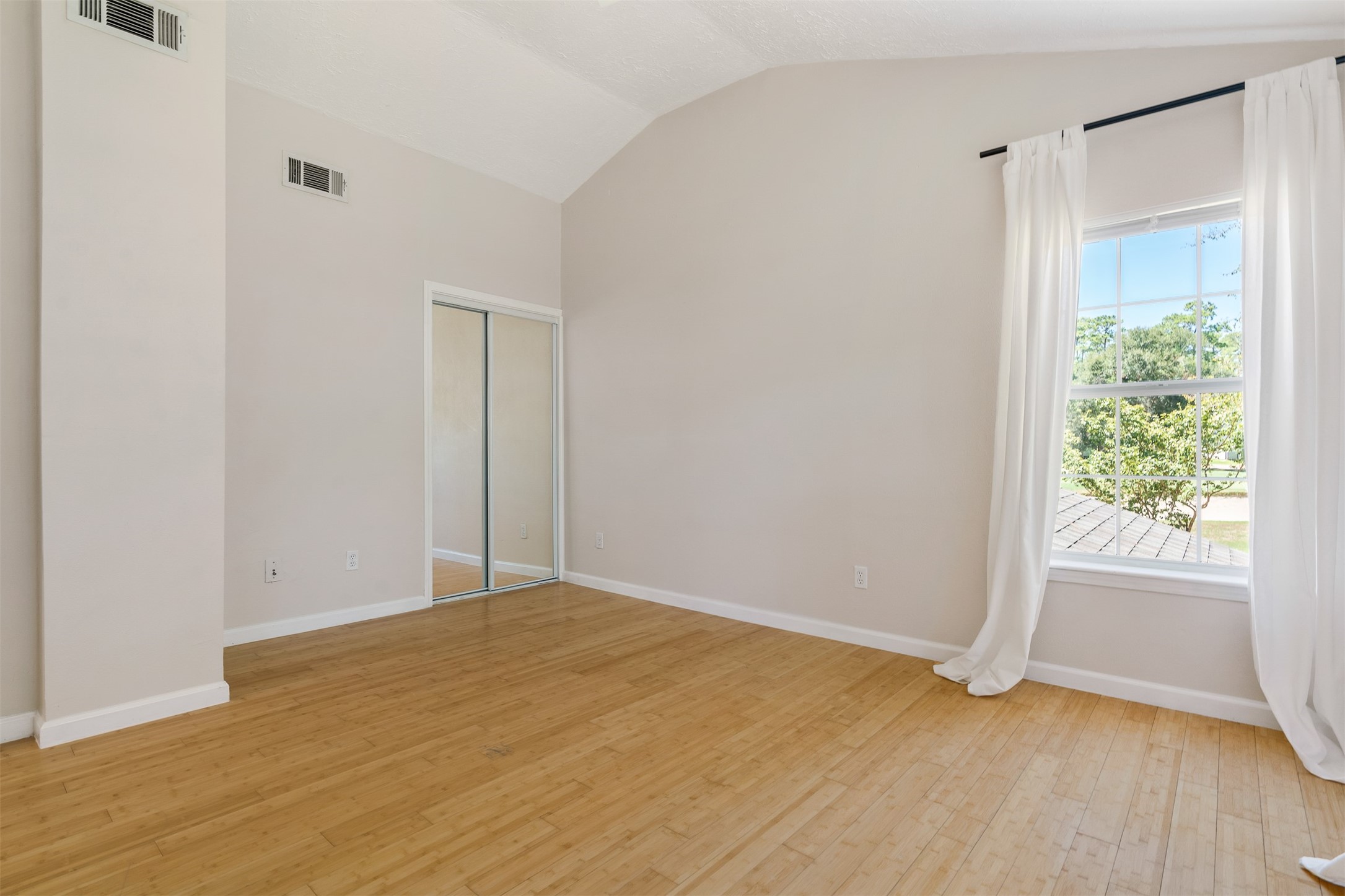 3219 Chippers Crossing Montgomery, TX 77356 - Photo 26 of 35 a view of an empty room with wooden floor and a window