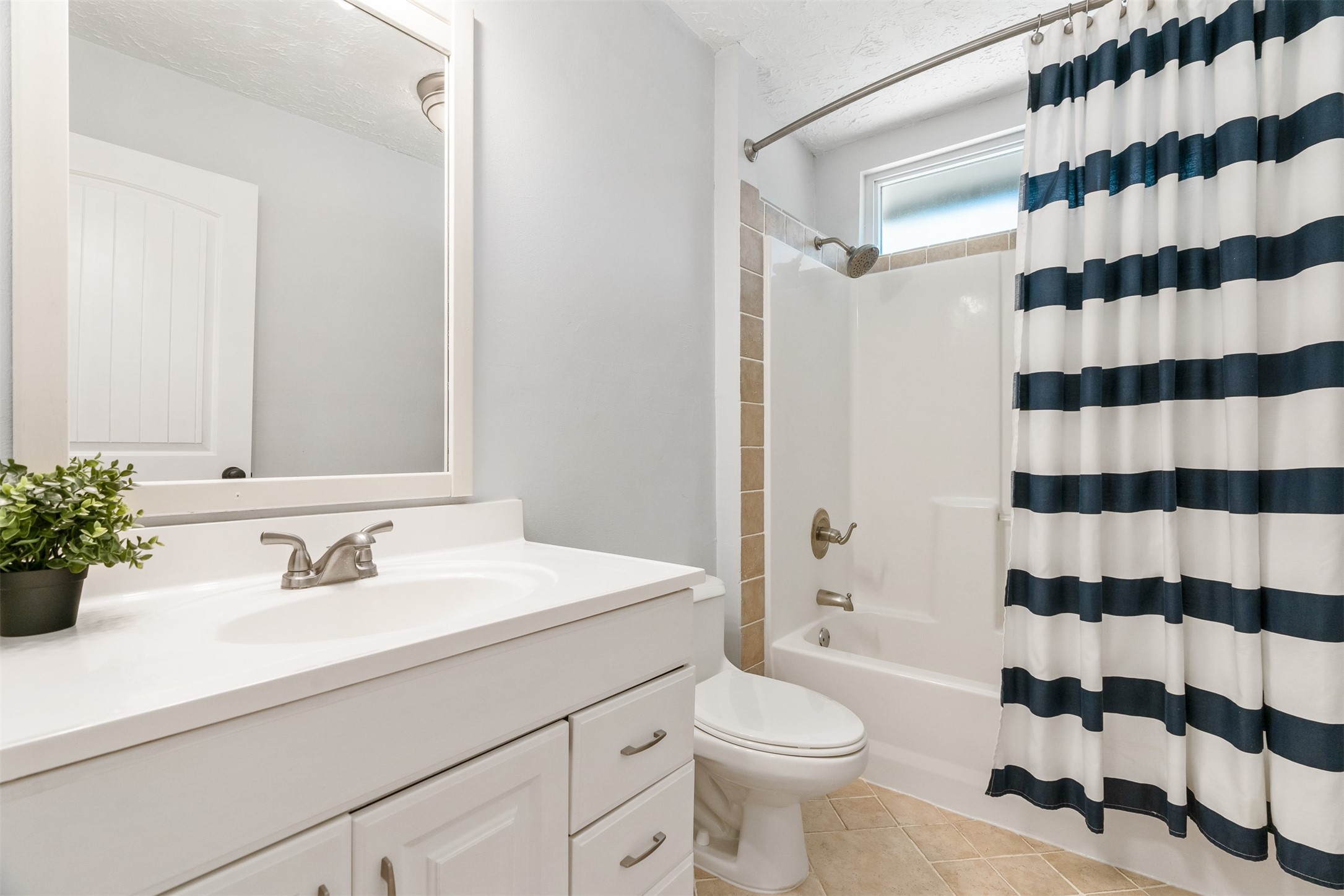 3219 Chippers Crossing Montgomery, TX 77356 - Photo 28 of 35 a bathroom with a sink a toilet a shower and a mirror