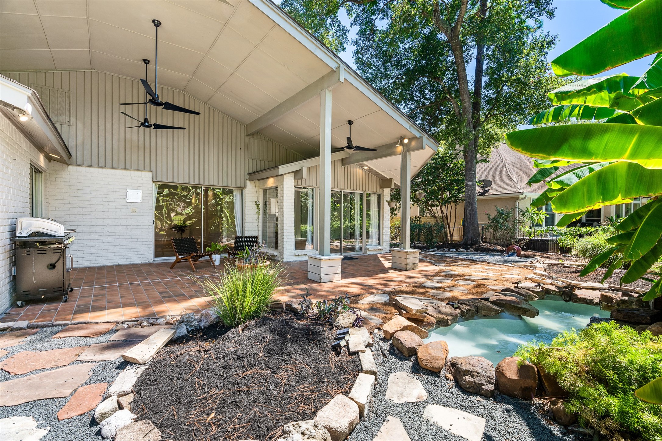 3219 Chippers Crossing Montgomery, TX 77356 - Photo 33 of 35 a view of a patio with table and chairs potted plants