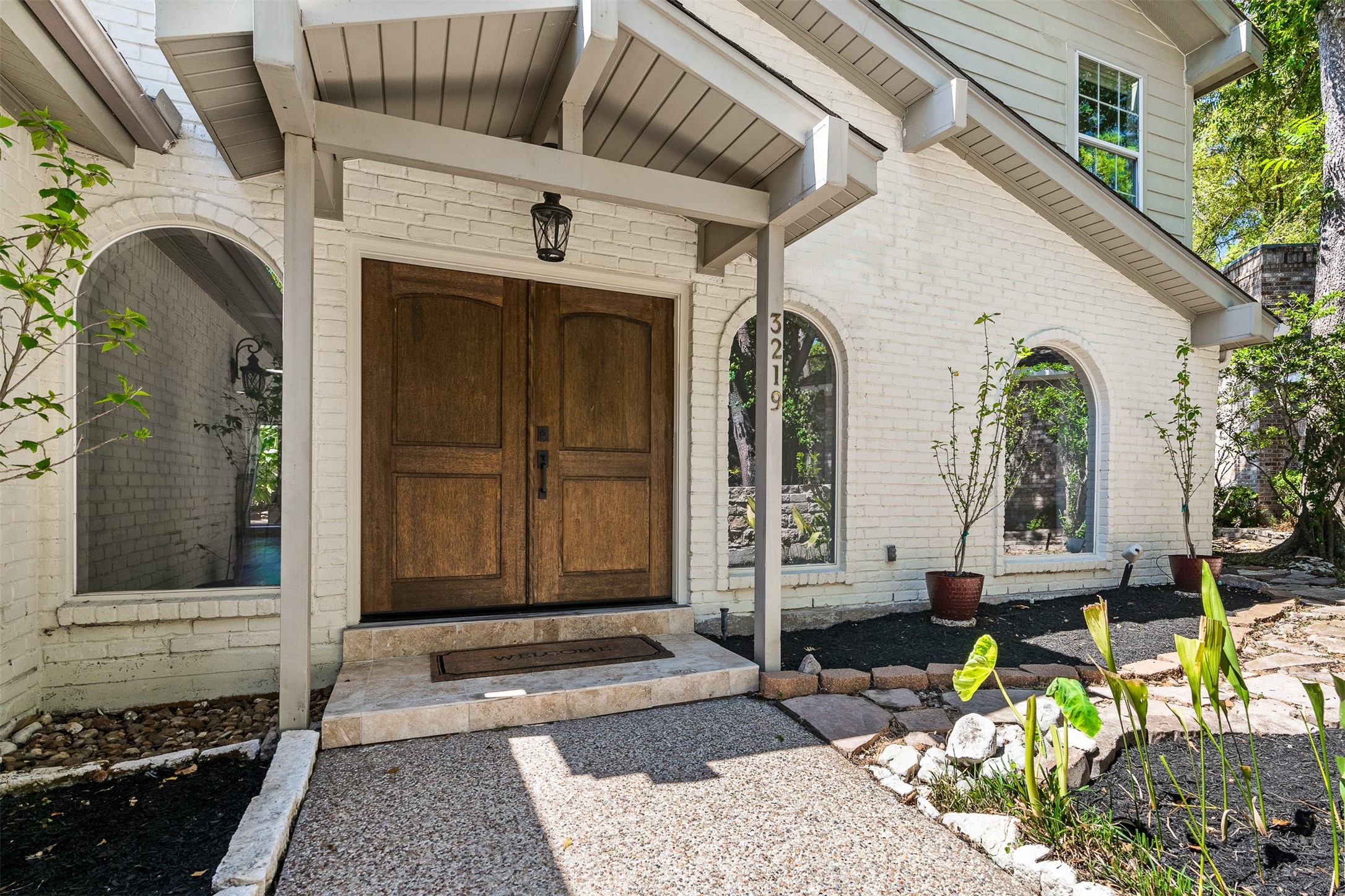 3219 Chippers Crossing Montgomery, TX 77356 - Photo 4 of 35 a front view of a house with garden