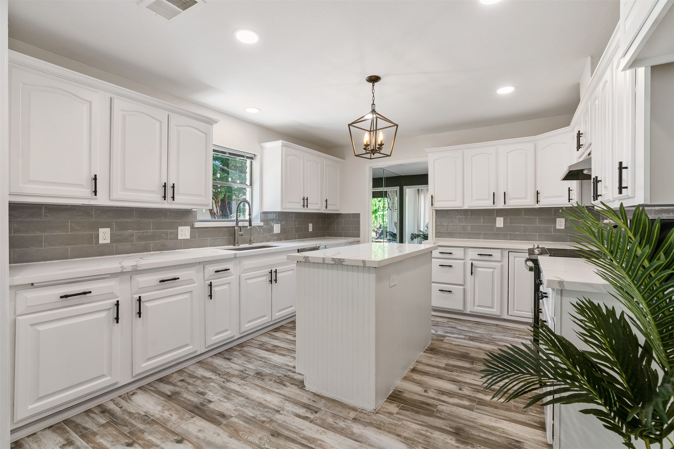 3219 Chippers Crossing Montgomery, TX 77356 - Photo 6 of 35 a kitchen with a white cabinets and window